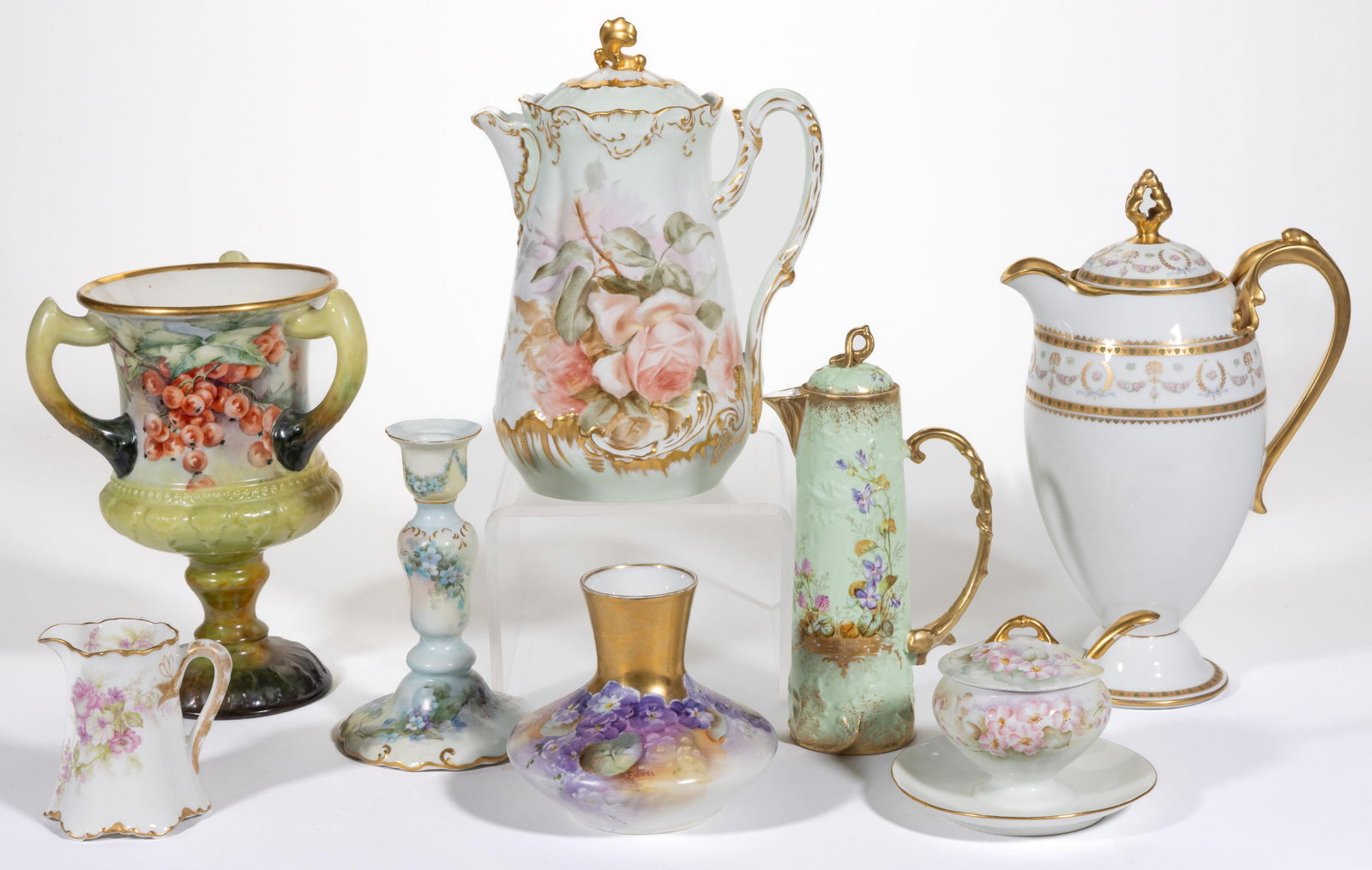FRENCH LIMOGES / GERMAN PORCELAIN FLORAL MOTIF ARTICLES, LOT OF EIGHT: FRENCH LIMOGES / GERMAN PORCELAIN FLORAL MOTIF ARTICLES, LOT OF EIGHT, including six hand-painted examples consisting of a large three-handled pedestalled cup featuring red berry motif, a candles