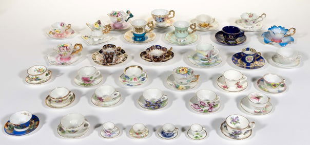JAPANESE PORCELAIN MINIATURE CUP AND SAUCER SETS, LOT OF 34