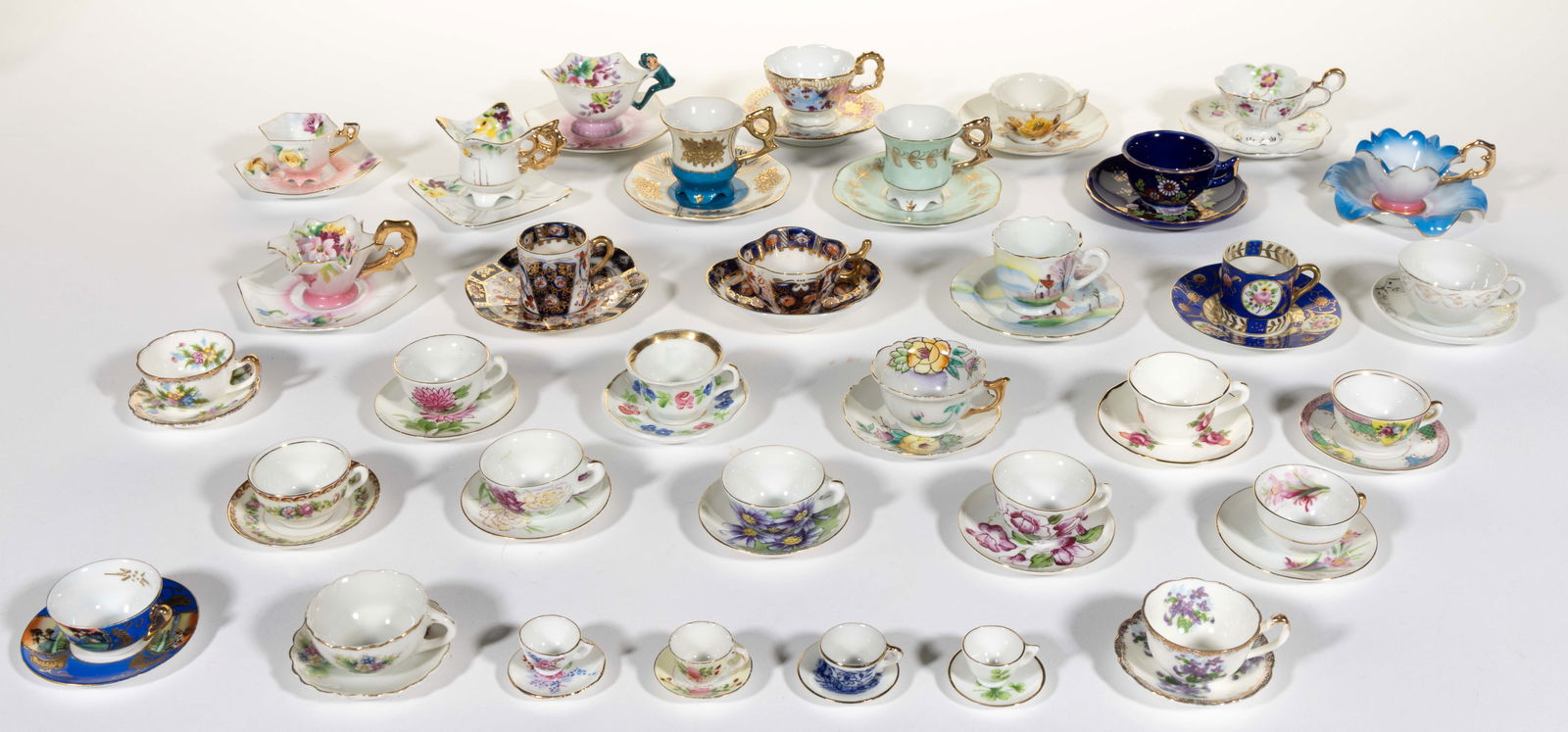 JAPANESE PORCELAIN MINIATURE CUP AND SAUCER SETS, LOT OF 34 (1 of 1)