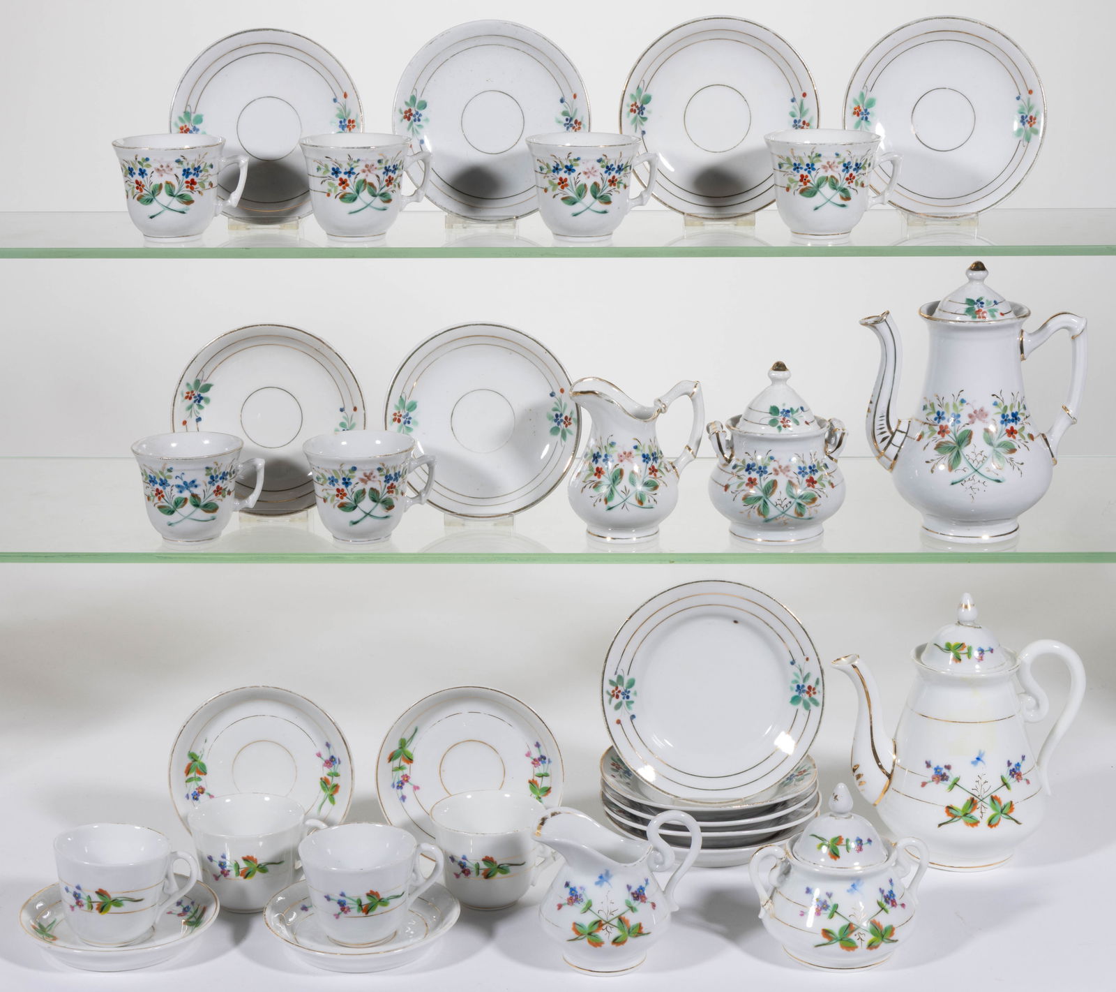 CONTINENTAL HAND-PAINTED FLORAL MOTIF CERAMIC CHILDREN'S TEA SETS, LOT OF 31 PIECES (1 of 1)