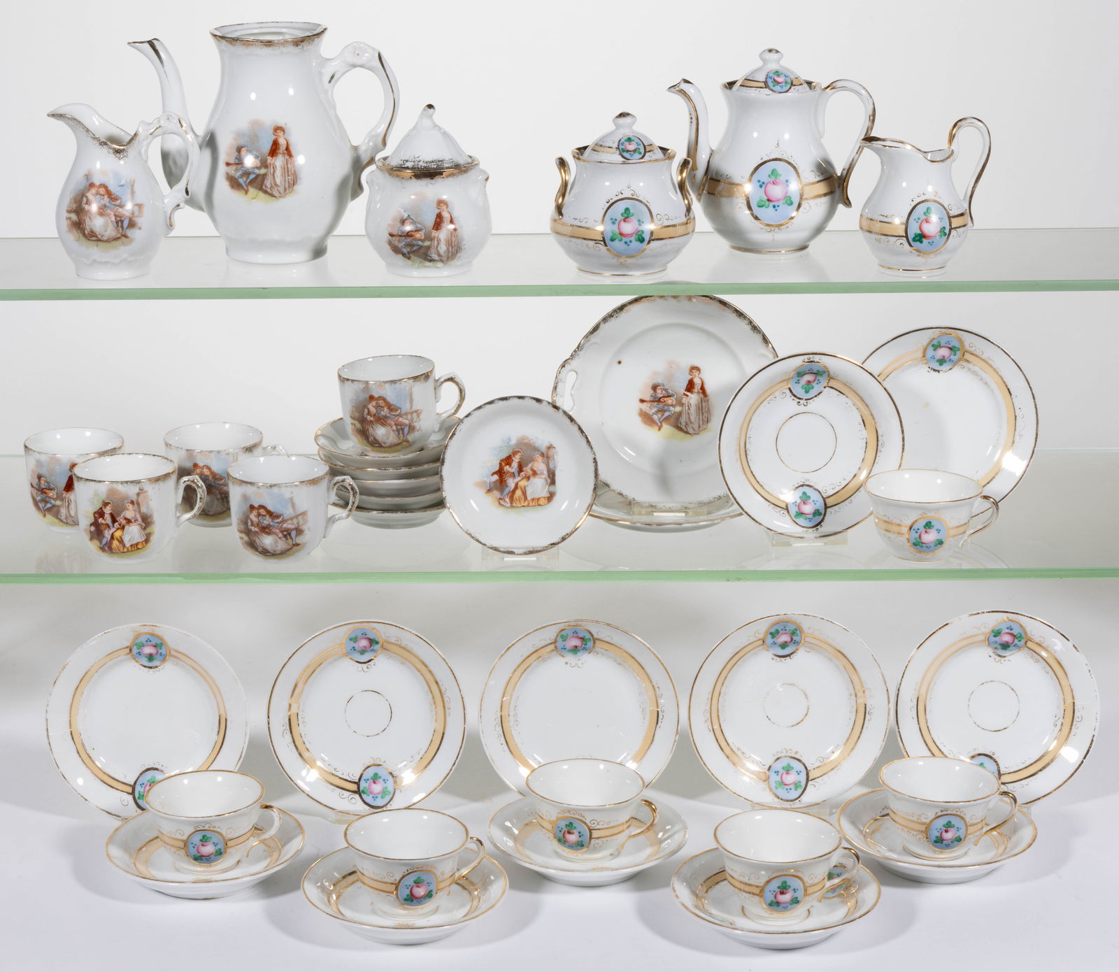 GERMAN PORCELAIN CHILDREN'S TEA SETS, LOT OF 37 PIECES (1 of 1)