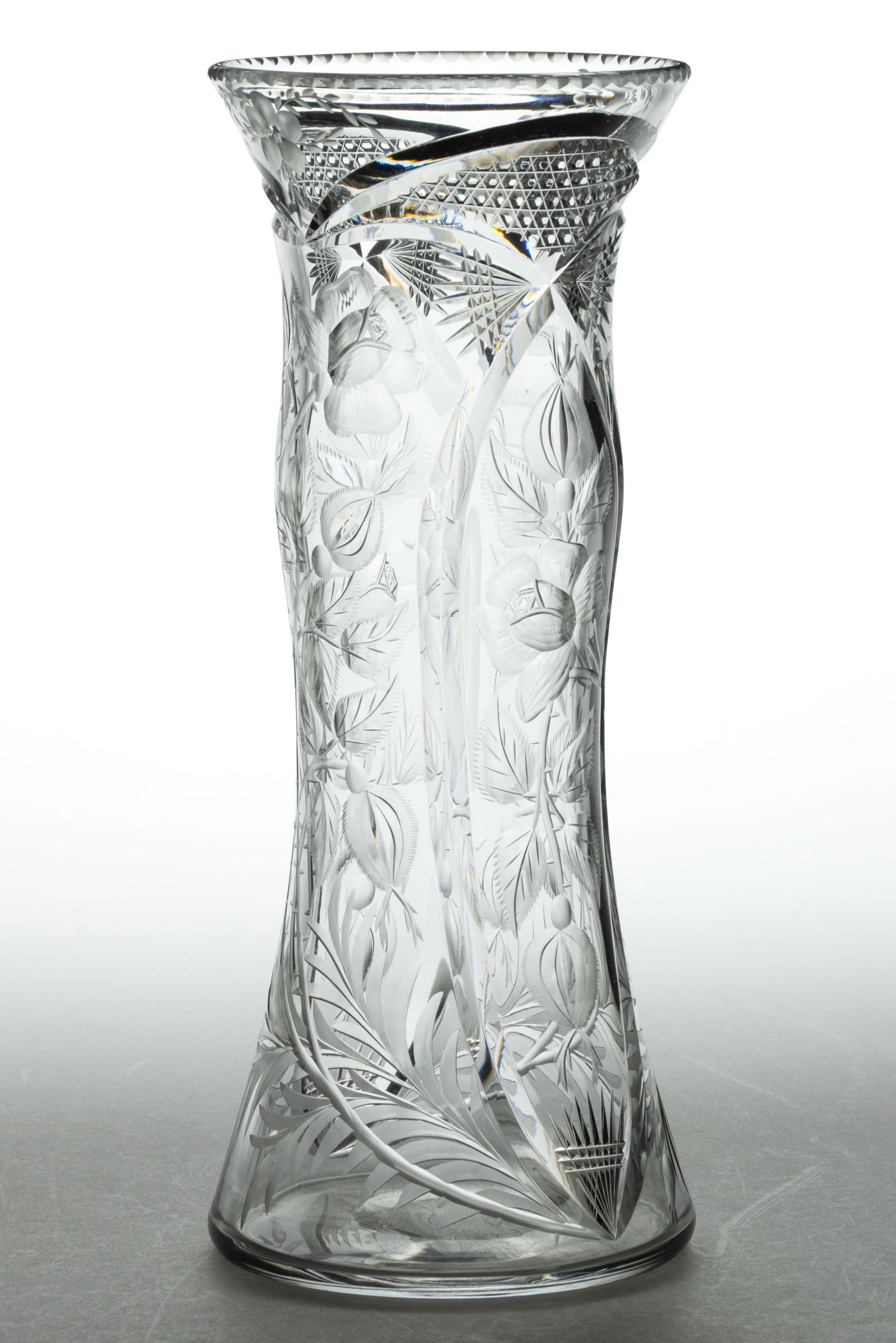 LIBBEY INTAGLIO CUT GLASS VASE: LIBBEY INTAGLIO CUT GLASS VASE, colorless, notched rim, intaglio cut floral design, polished pontil mark, "Libbey" trademark acid stamped signature to the underside. 