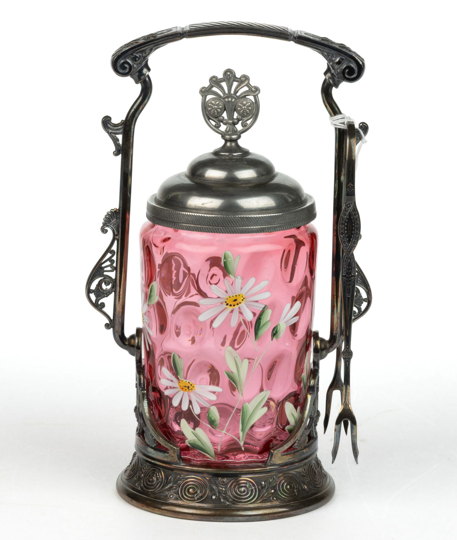 VICTORIAN SPOT-OPTIC ENAMEL-DECORATED GLASS PICKLE CASTER: VICTORIAN SPOT-OPTIC AND ENAMEL-DECORATED GLASS PICKLE CASTER, cranberry with floral decoration, fitted into a quadruple-plate stand marked for "REED & BARTON", and numbered "1