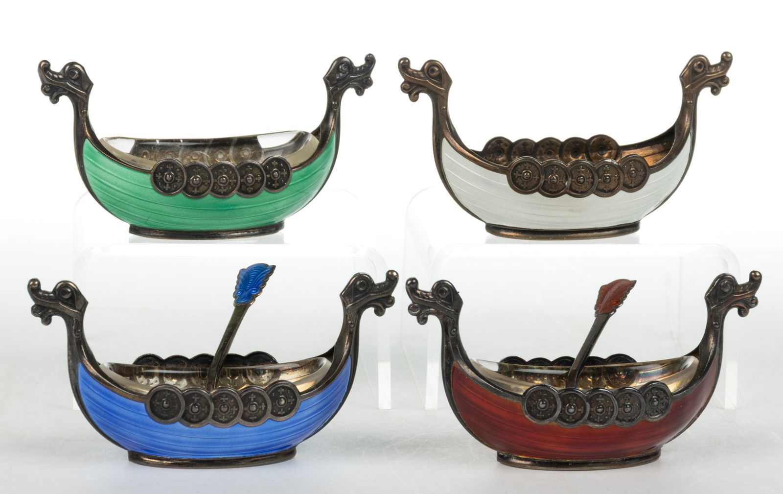 NORWEGIAN STERLING SILVER AND ENAMEL OPEN SALTS, SET OF FOUR: NORWEGIAN STERLING SILVER AND ENAMEL OPEN SALTS, SET OF FOUR, Viking ship form, each with a different color enameled exterior, hallmarked for Theodor Olsens Eftf of Bergen, three with original co
