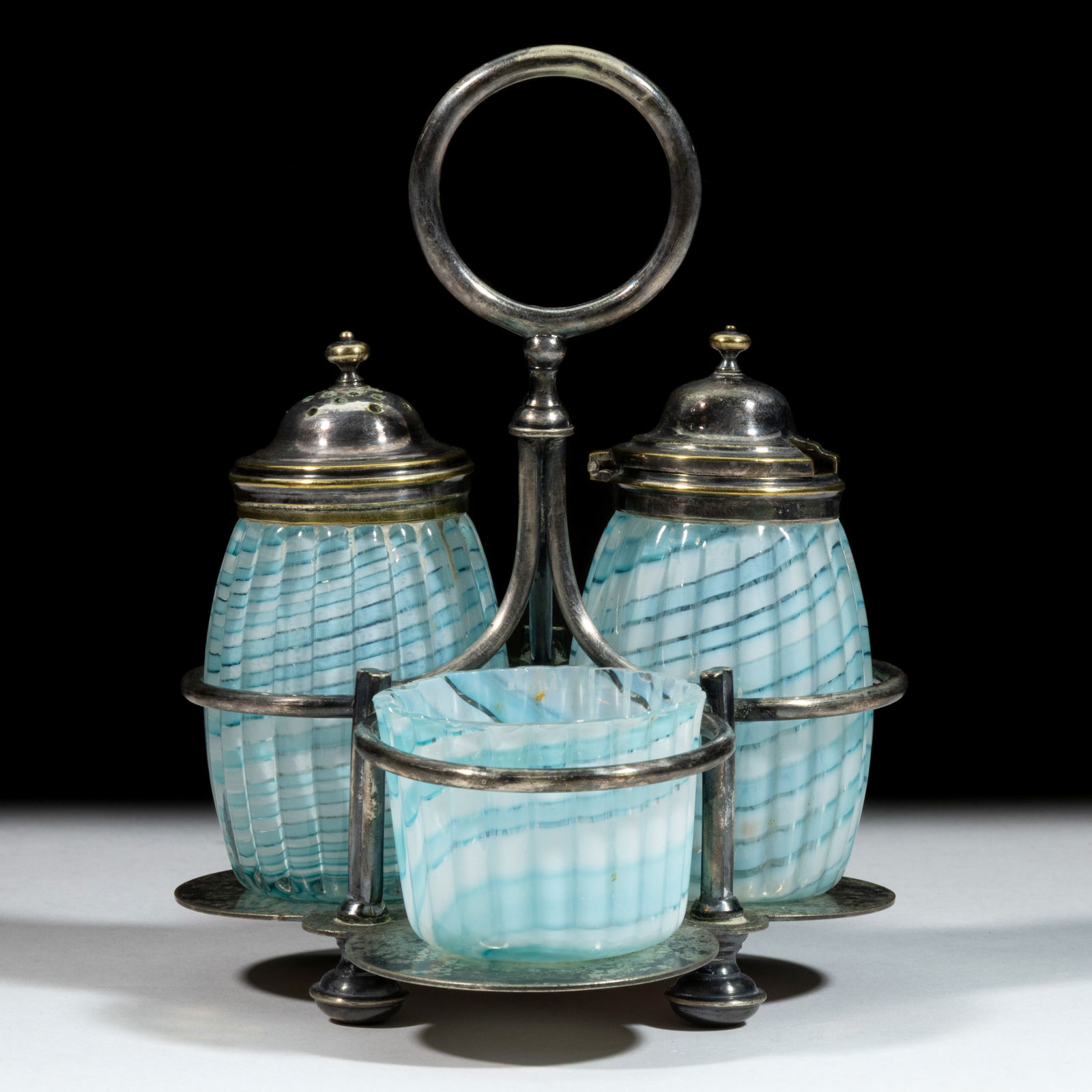 BARREL TWENTY-ONE RIB RIBBON CONDIMENT SET: BARREL TWENTY-ONE RIB RIBBON CONDIMENT SET, cased alternating swirled blue and opal ribbons, comprising a barrel rib form pepper shaker and mustard pot with a ribbed open salt, fitted in a quadru
