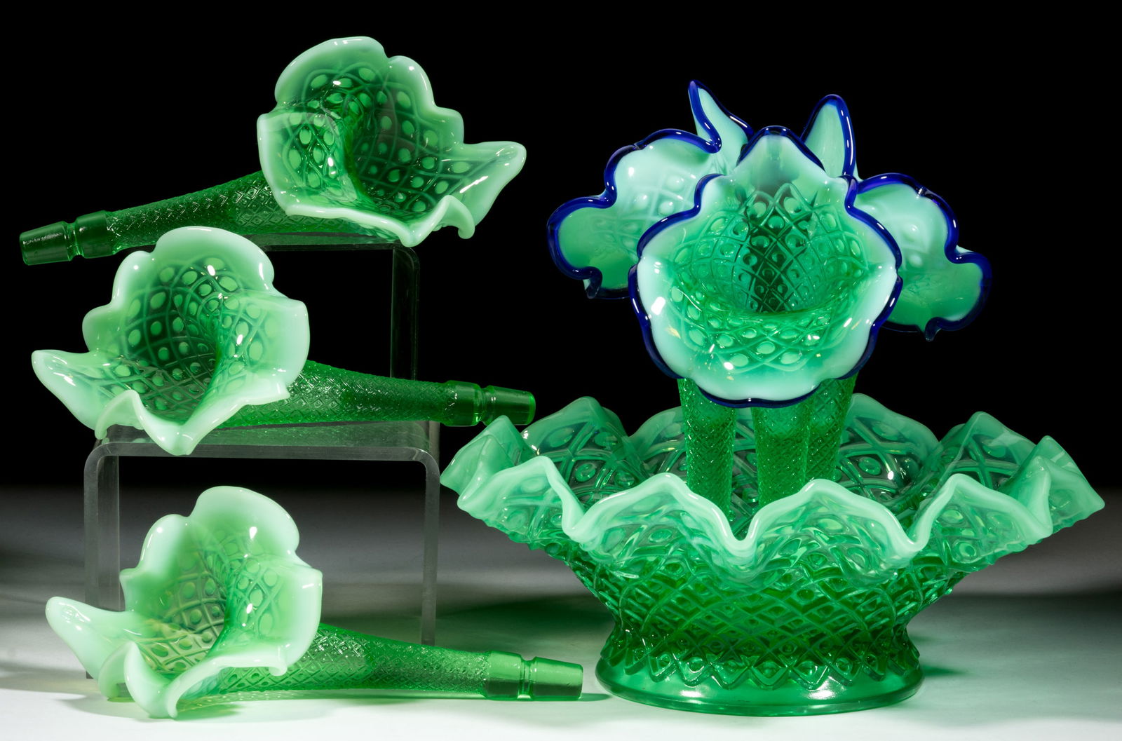 FENTON DIAMOND LACE OPALESCENT GLASS EPERGNE AND JACK-IN-THE-PULPIT VASES, LOT OF SEVEN: FENTON DIAMOND LACE OPALESCENT GLASS EPERGNE AND JACK-IN-THE-PULPIT VASES, LOT OF SEVEN, green opalescent and cobalt blue (reacts under black light), comprising a crimped and ruffled-rim bowl, a set o