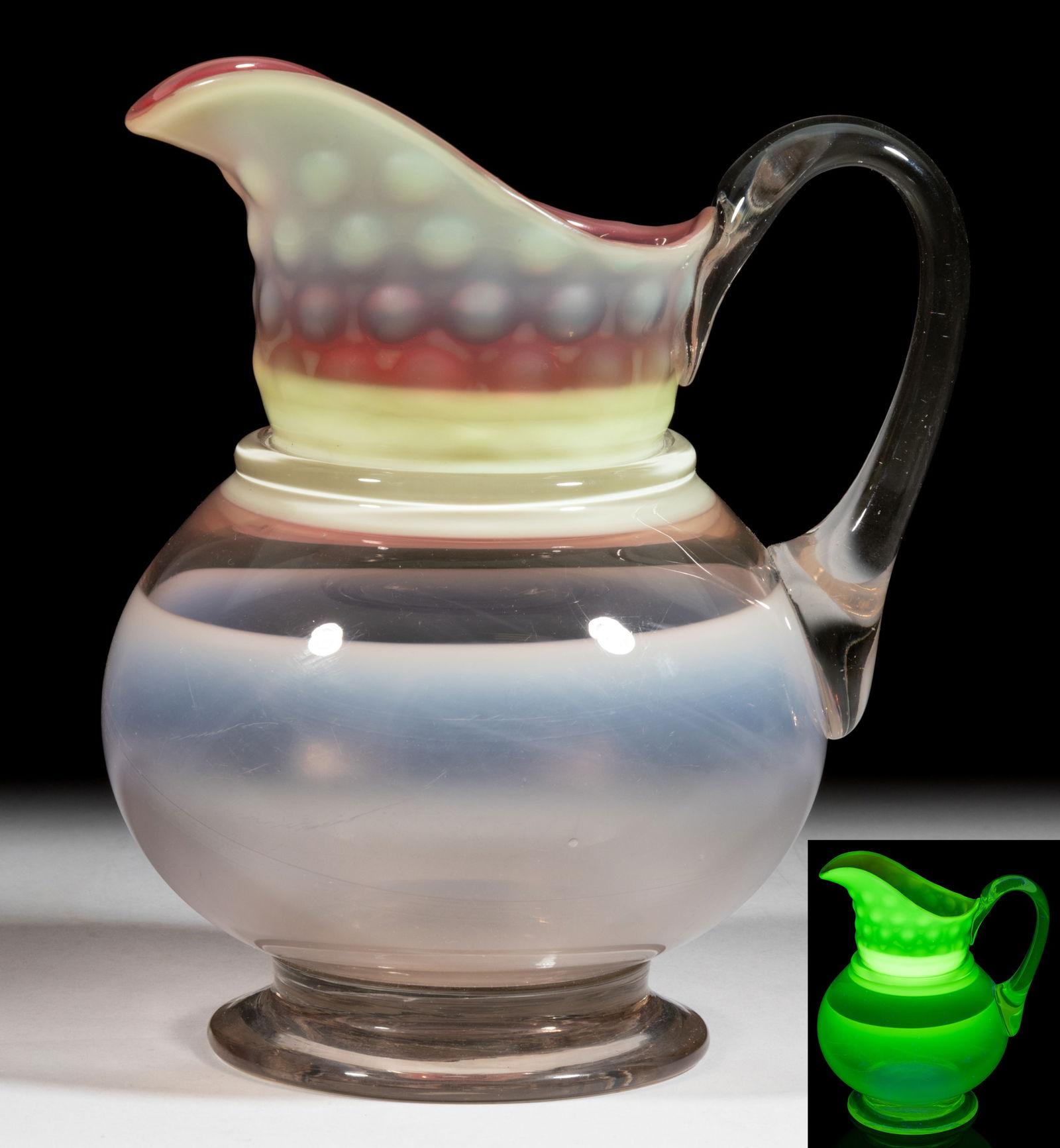 AMERICAN EXPERIMENTAL BLOWN OPALESCENT WATER PITCHER / JUG: AMERICAN EXPERIMENTAL BLOWN OPALESCENT WATER PITCHER / JUG, reacts under black light, the cranberry to custard Dot-Optic neck and rim applied to the pink to colorless unpatterned bulbous body, raised