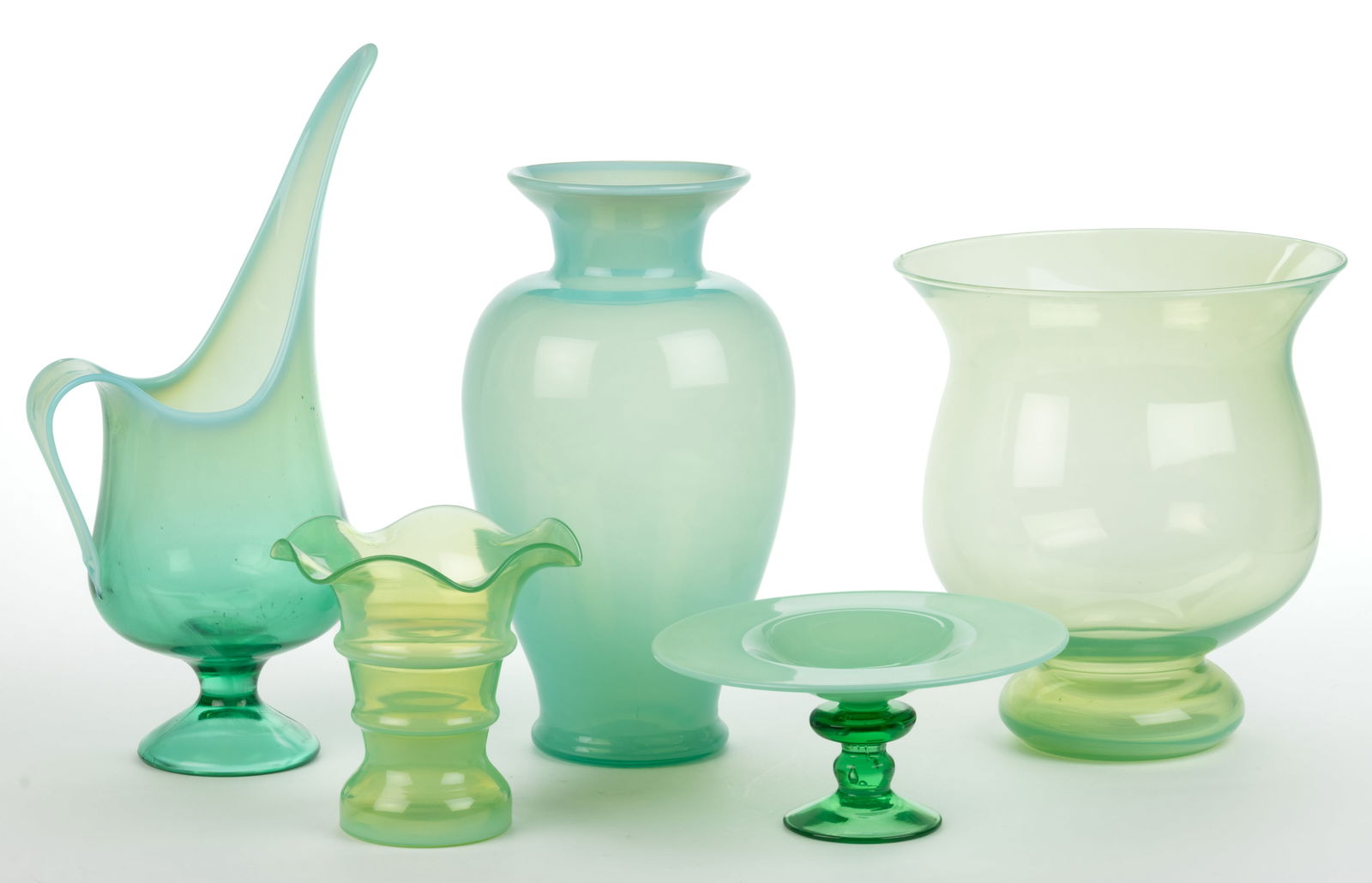 ASSORTED BLOWN AND PRESSED OPALESCENT GLASS ARTICLES, LOT OF FIVE: ASSORTED BLOWN AND PRESSED OPALESCENT GLASS ARTICLES, LOT OF FIVE, green opalescent, comprising an ovoid-shaped vase with flared rim, bulbous footed hurricane vase, shallow footed compote, Altaglass r