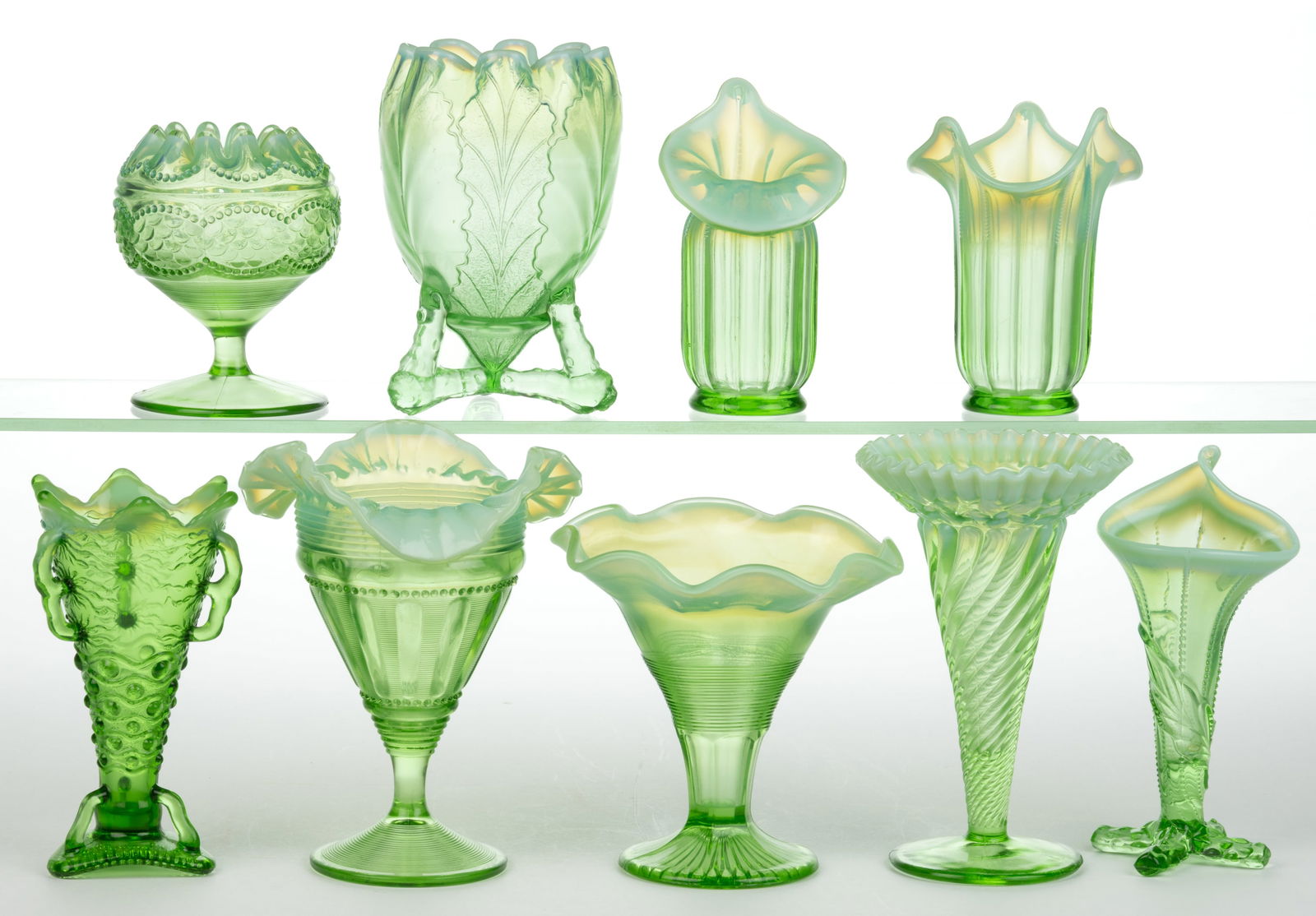 ASSORTED OPALESCENT GLASS VASES, LOT OF NINE: ASSORTED OPALESCENT GLASS VASES, LOT OF NINE, green opalescent, comprising an Aurora Borealis, Dahlia No. 207, Fluted Bars & Beads, Cabbage Leaf, Winter Lily, Simply Simon, Pearls and Scales rose
