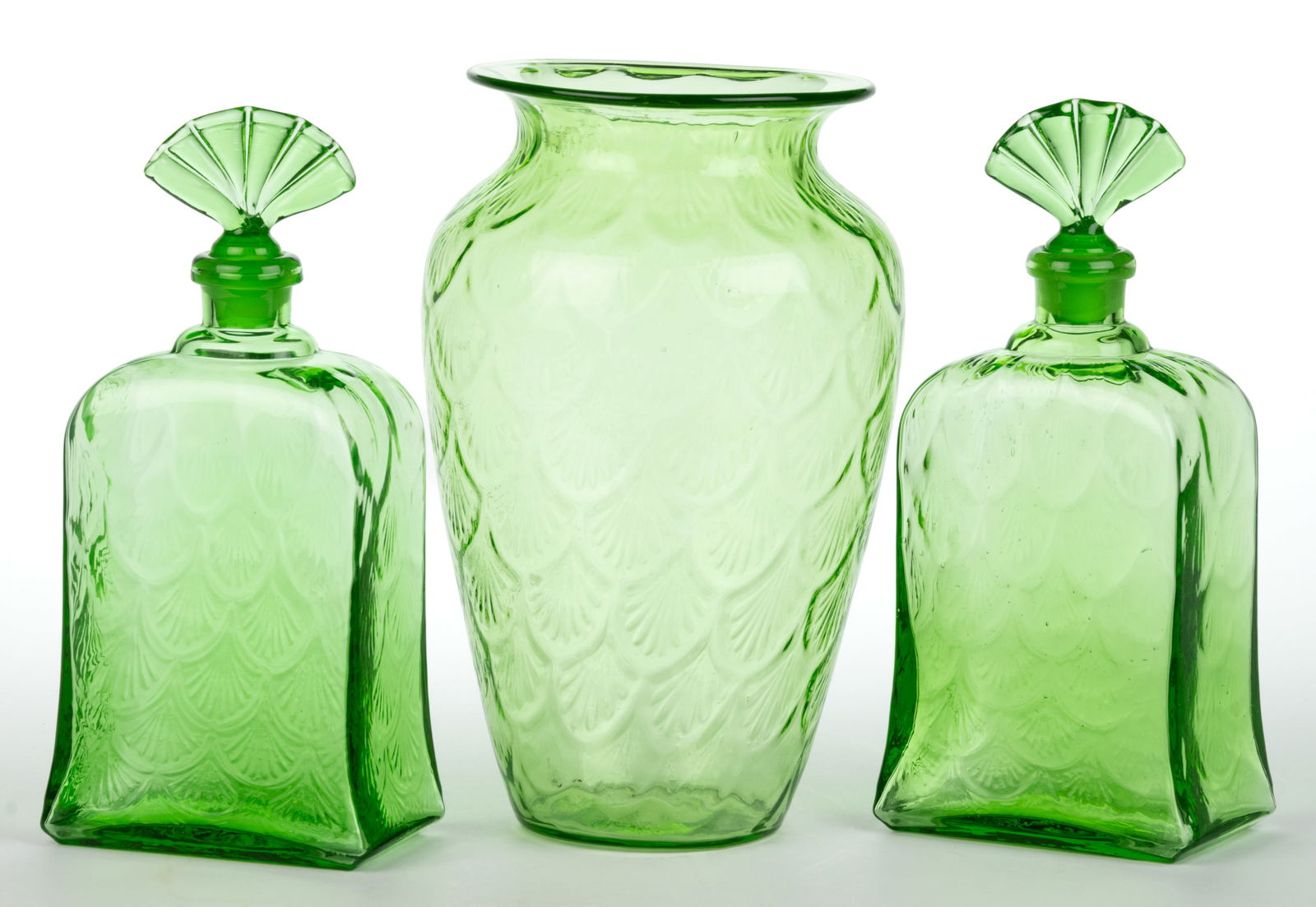 PUKEBERG TURKEY TRACK / ROYAL FAN ARTICLES, LOT OF THREE: PUKEBERG TURKEY TRACKS / ROYAL FAN ARTICLES, LOT OF THREE, uranium green (reacts under black light), comprising a baluster-form vase and two perfumes.Pukeberg Glassworks, Sweden. Circa 1920.