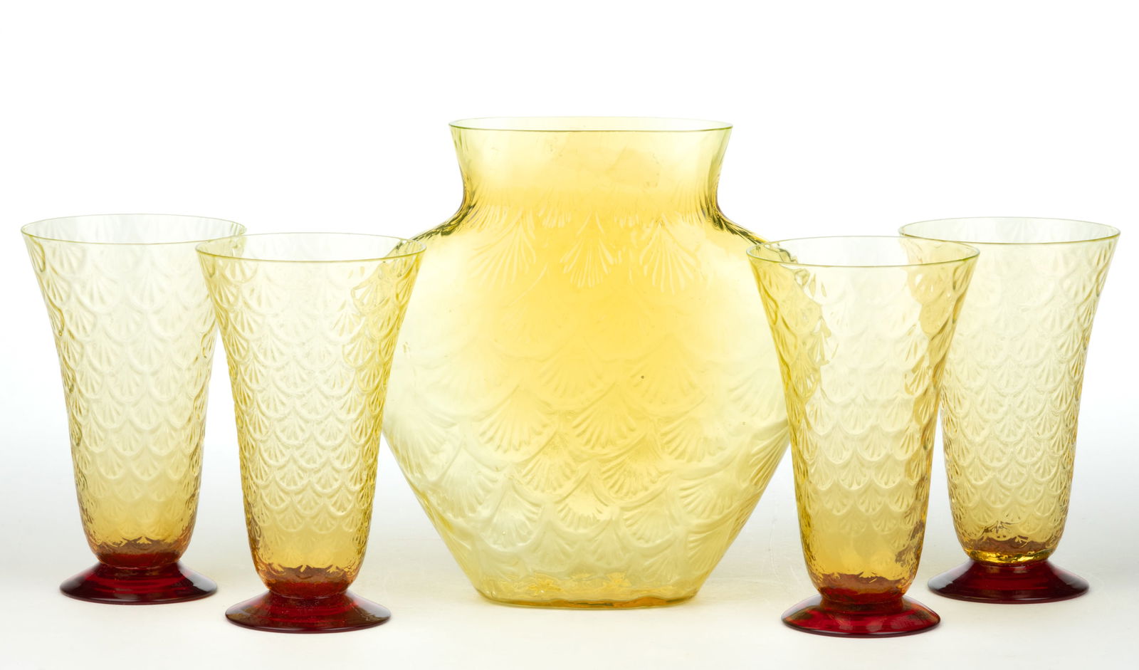 PUKEBERG TURKEY TRACKS / ROYAL FAN ARTICLES, LOT OF FIVE: PUKEBERG TURKEY TRACKS / ROYAL FAN ARTICLES, LOT OF FIVE, amber-toned Vaseline (reacts under black light), comprising four water tumblers on applied cranberry feet and an urn-form high-shouldered vase