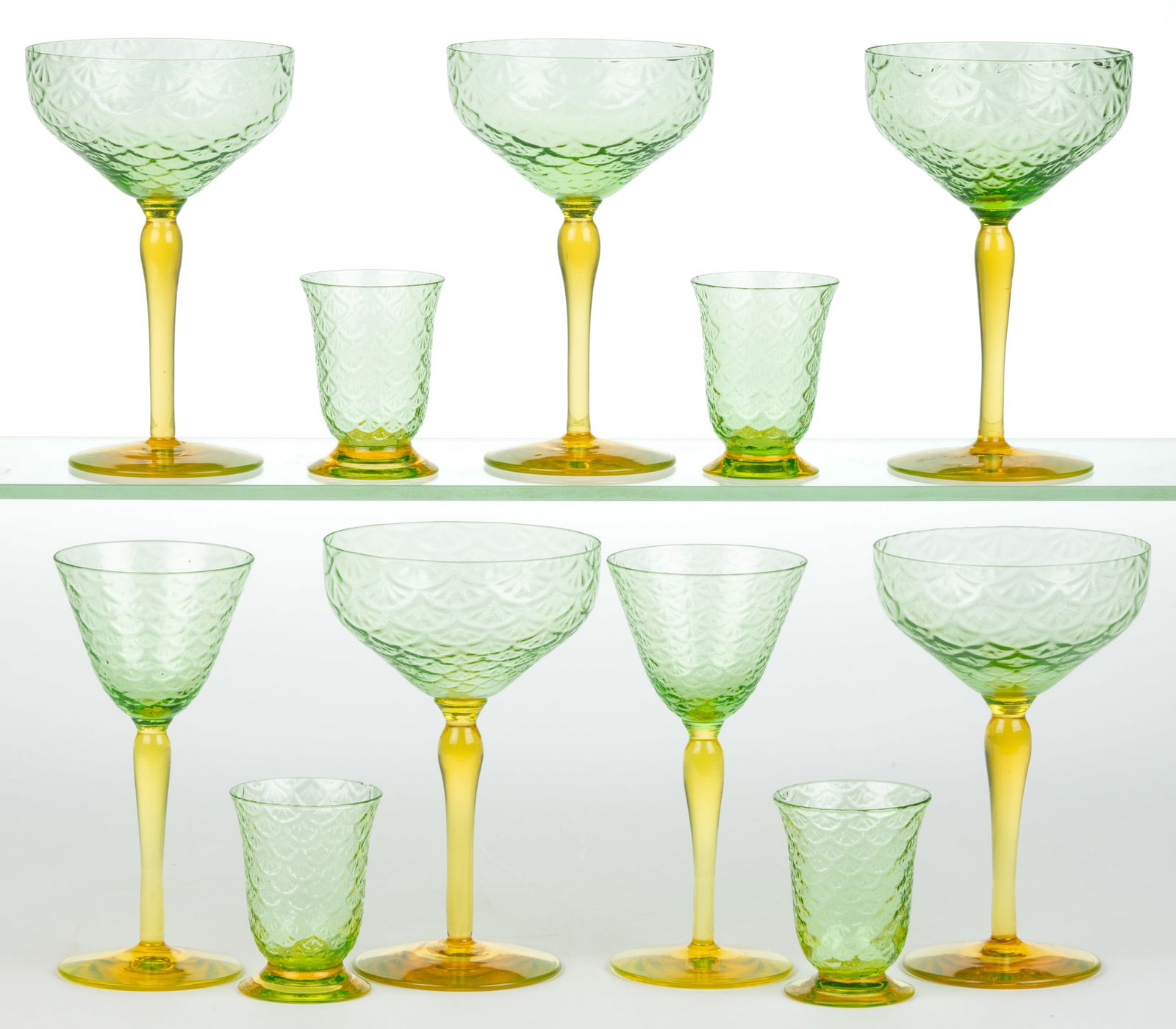 PUKEBERG TURKEY TRACKS / ROYAL FAN DRINKING ARTICLES, LOT OF 11: PUKEBERG TURKEY TRACKS / ROYAL FAN DRINKING ARTICLES, LOT OF 11, uranium green (reacts under black light) with applied amber-toned Vaseline (reacts under black light) stems and feet,