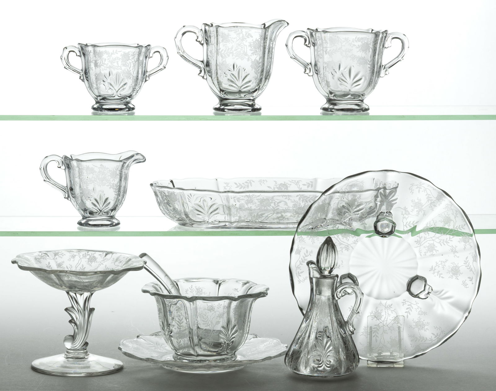 FOSTORIA CHINTZ BAROQUE SHAPE ETCHED CRYSTAL GLASS ARTICLES, LOT OF 11: FOSTORIA CHINTZ BAROQUE SHAPE ETCHED CRYSTAL GLASS ARTICLES, LOT OF 11, colorless, comprising one footed creamer, one individual footed creamer, one open sugar, one individual footed sugar, one