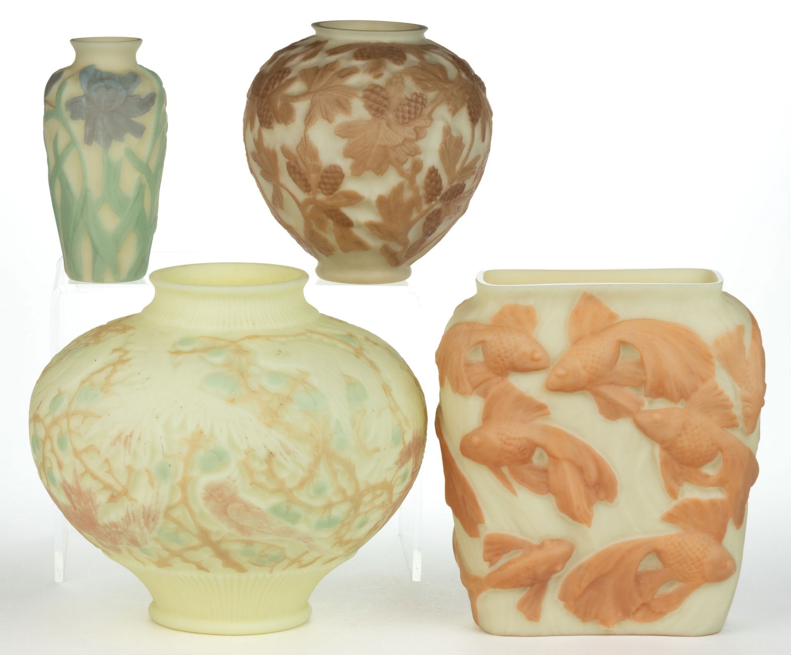 CONSOLIDATED ART GLASS VASES, LOT OF FOUR: CONSOLIDATED ART GLASS VASES, LOT OF FOUR, custard with various colored highlights, comprising a Cockatoo, a Jonquil, a Pine Cone, and a Tropical Fish. Consolidated Lamp & Glass Co.
