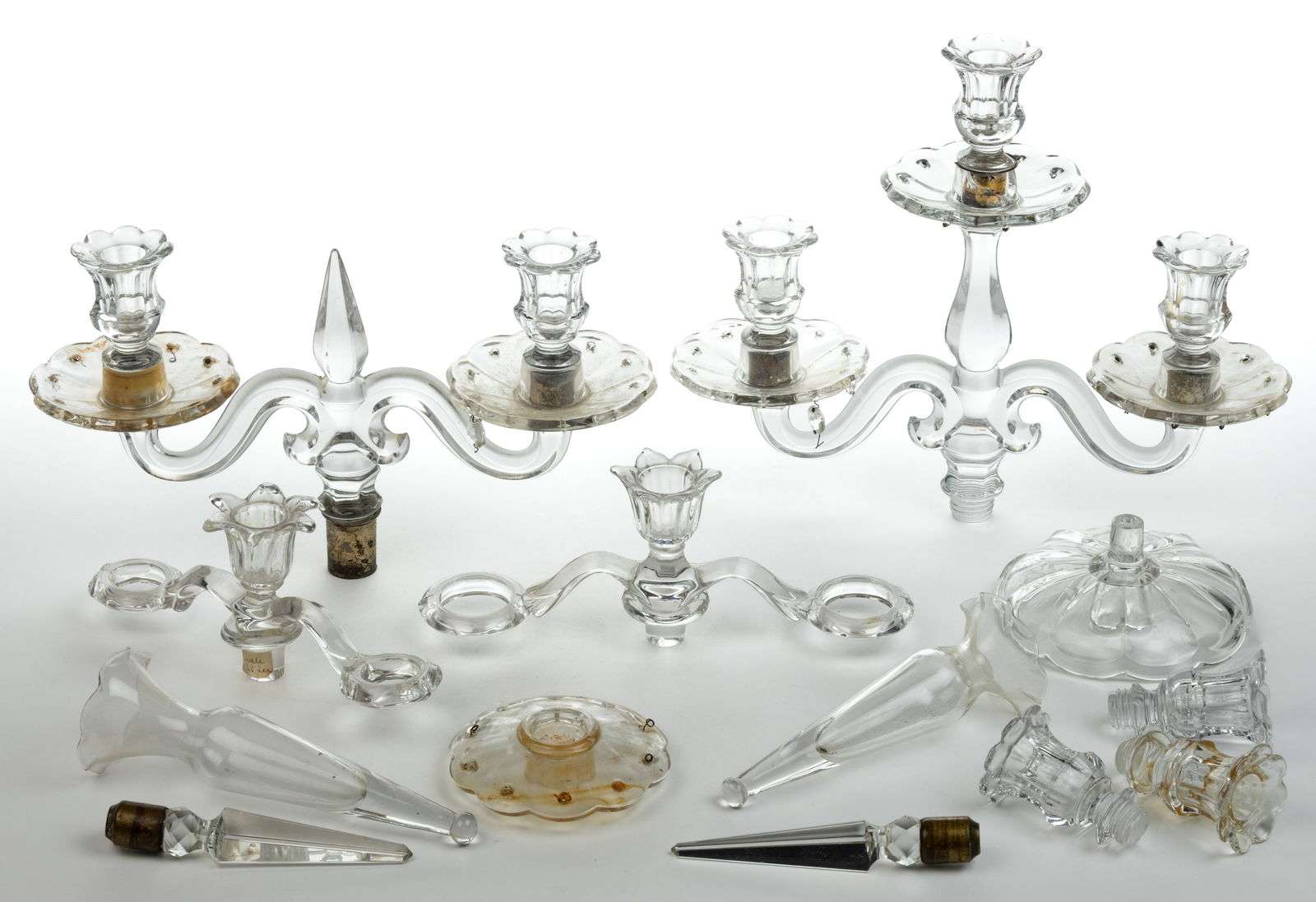 ASSORTED CANDELABRA AND EPERGNE COMPONENTS, UNCOUNTED LOT: ASSORTED CANDELABRA AND EPERGNE COMPONENTS, UNCOUNTED LOT, colorless, comprising of two double-arm Heisey No. 301/Old Williamsburg candelabra examples, each with a drip catcher and fitted for prisms,