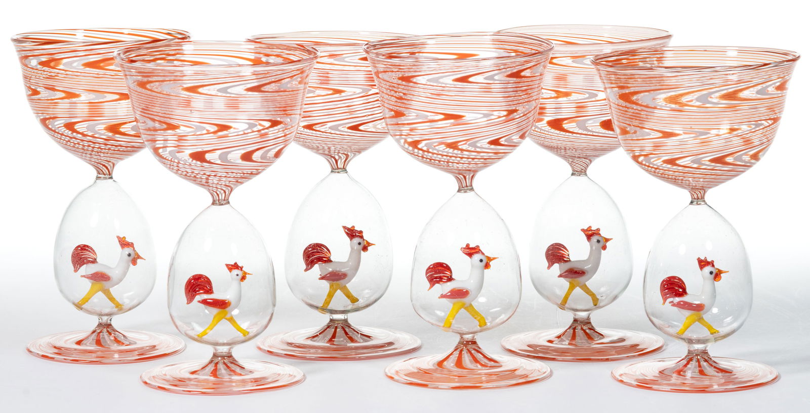 GERMAN ART GLASS BIMINI-TYPE ROOSTER COCKTAIL GLASSES / COUPES, SET OF SIX: GERMAN ART GLASS BIMINI-TYPE ROOSTER COCKTAIL GLASSES / COUPES, SET OF SIX, orange and white swirl on colorless, each having a lampwork figure of a white rooster in the stem. First half 20th