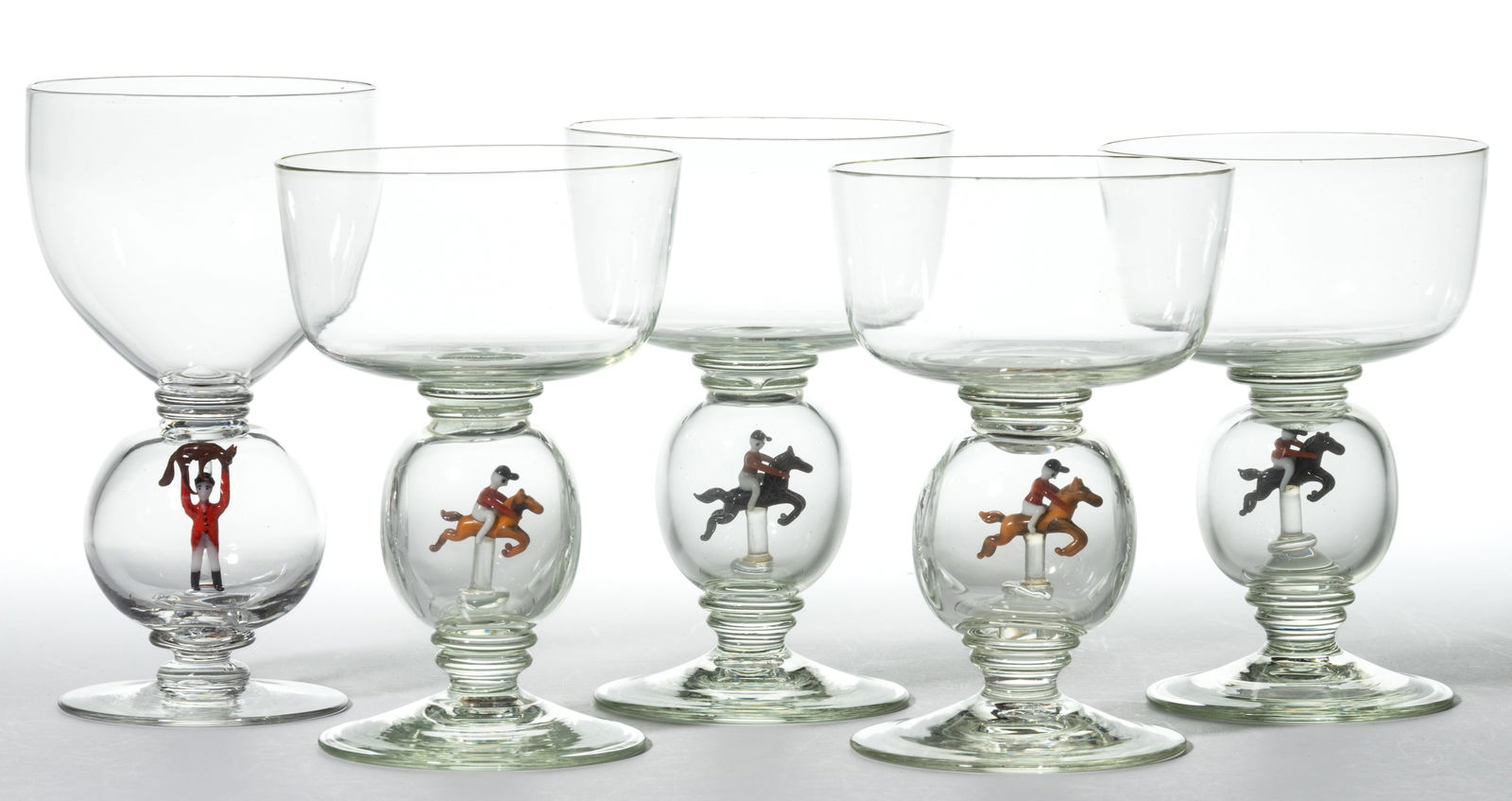 GERMAN ART GLASS BIMINI-TYPE FOX HUNT / EQUESTRIAN GOBLETS, LOT OF FIVE: GERMAN ART GLASS BIMINI-TYPE FOX HUNT / EQUESTRIAN GOBLETS, LOT OF FIVE, colorless, comprising a set of four with a lampwork figure riding a horse, and a slightly different single example with a