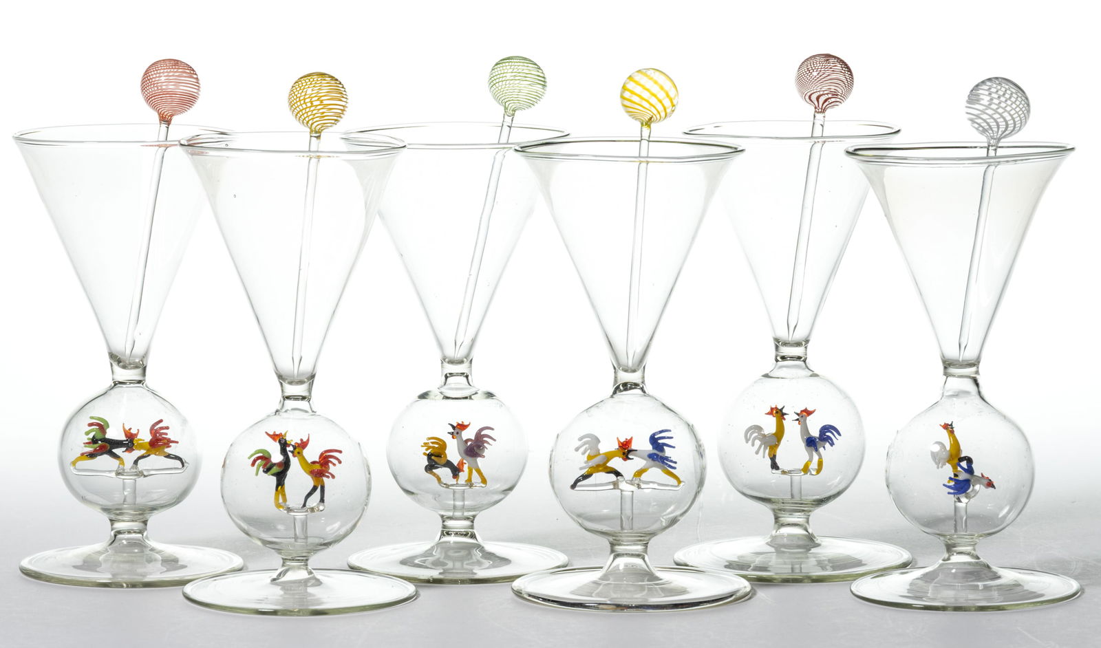 GERMAN ART GLASS BIMINI-TYPE ROOSTER / FIGHTING COCKS WINE / COCKTAIL GLASSES WITH PICKS, SET OF 12: GERMAN ART GLASS BIMINI-TYPE ROOSTER / FIGHTING COCKS WINE / COCKTAIL GLASSES WITH PICKS, SET OF 12, colorless, each having a lampwork figure of fighting roosters in the stem with six associated swizz
