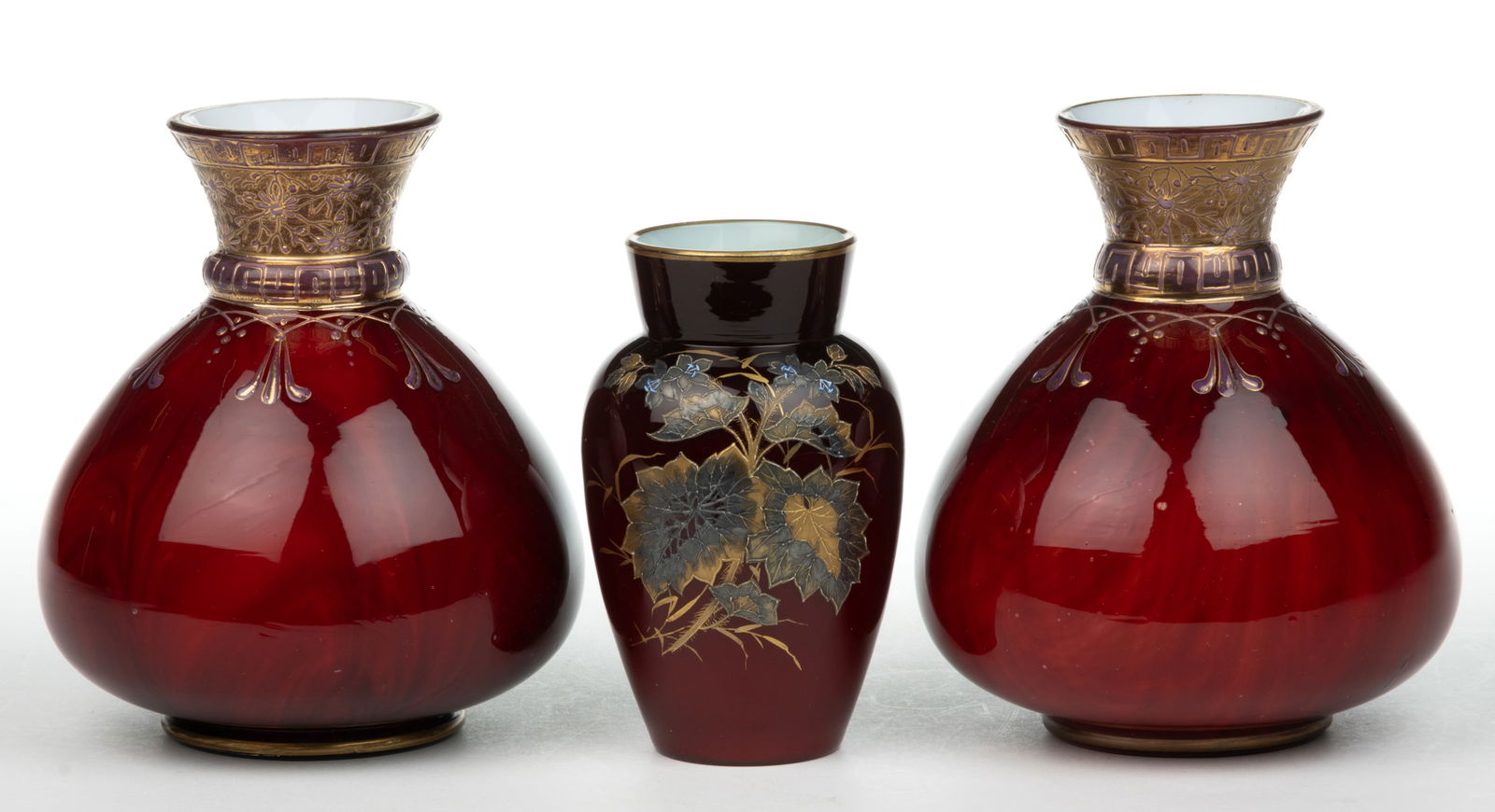 LOETZ ATTRIBUTED ONYX / MARMORIERTE ART GLASS VASES, LOT OF THREE: LOETZ ATTRIBUTED ONYX / MARMORIERTE ART GLASS VASES, LOT OF THREE, opal cased Carneol with gilt and enamel decoration, comprising a pair of bulbous form examples and a shoulder form with flo