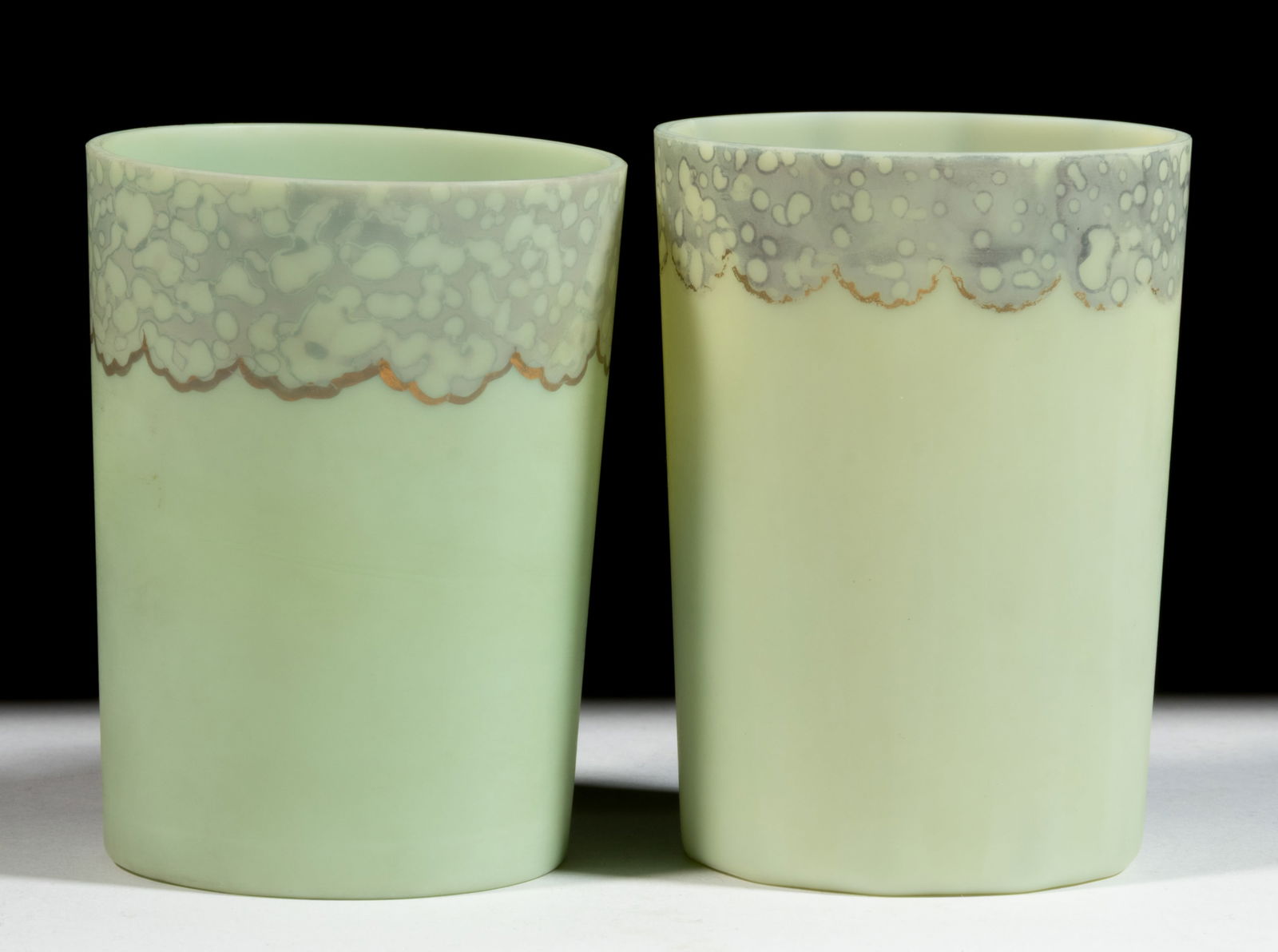 NEW ENGLAND GREEN OPAQUE TUMBLERS, LOT OF TWO DIFFERENT: NEW ENGLAND GREEN OPAQUE TUMBLERS, LOT OF TWO DIFFERENT, satin finish, retaining most of the decorations, one with gilt trim intact, comprising an unpatterned example and a 10-rib rib-optic