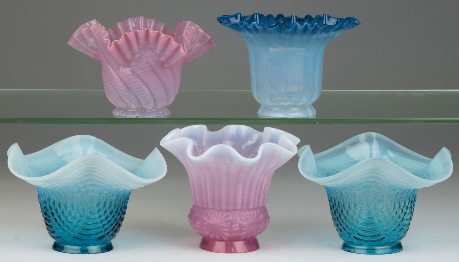 ASSORTED COLORED OPALESCENT ELECTRIC LAMP SHADES, LOT OF FIVE: ASSORTED COLORED OPALESCENT ELECTRIC LAMP SHADES, LOT OF FIVE, various colors, including a pair in medium teal blue with opalescent rims; a shaded blue opalescent example with a crimped rim; and a pin