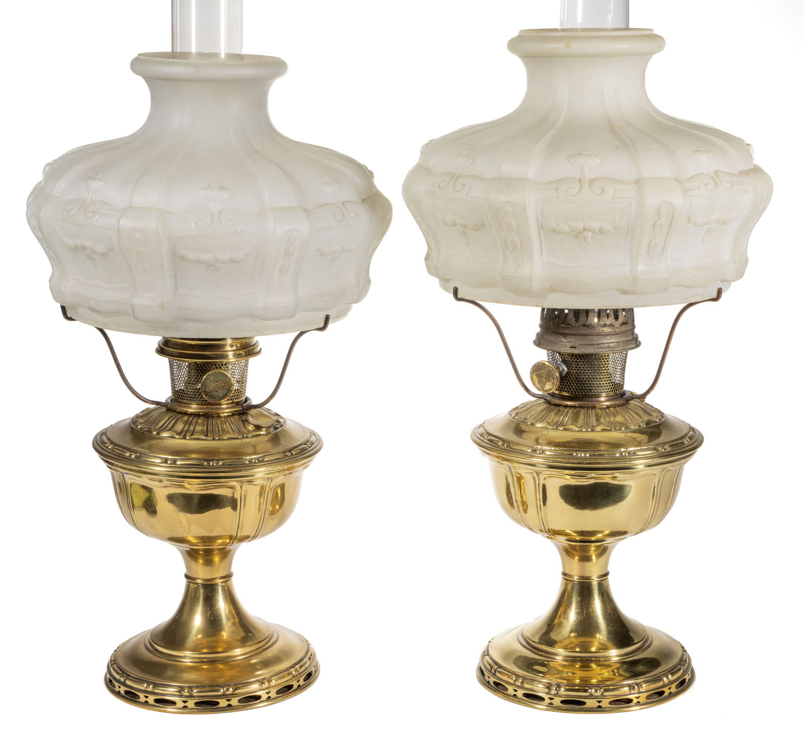 ALADDIN MODEL 8 KEROSENE STAND LAMPS, LOT OF TWO: ALADDIN MODEL 8 KEROSENE STAND LAMPS, LOT OF TWO, each with a paneled font and a circular-form foot with openwork ovals and diamonds to the edge, each with a side-refill feature within the should