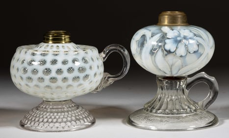 ASSORTED OPALESCENT PATTERNED KEROSENE FOOTED FINGER LAMPS, LOT OF TWO