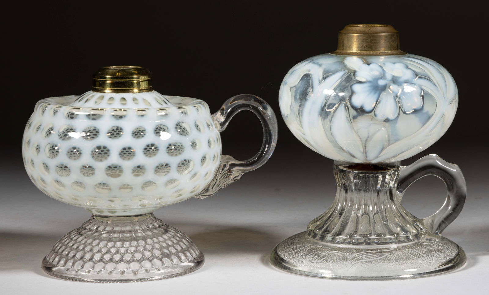 ASSORTED OPALESCENT PATTERNED KEROSENE FOOTED FINGER LAMPS, LOT OF TWO (1 of 1)