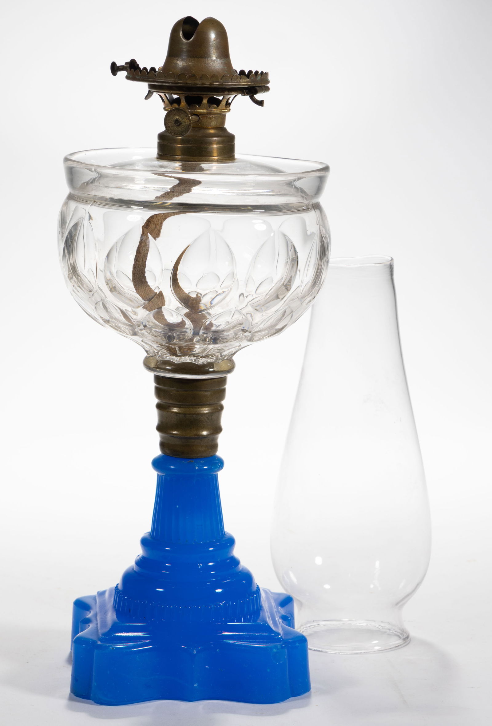 VIENNA PATENTED OIL-GUARD FONT KEROSENE STAND LAMP: VIENNA PATENTED OIL-GUARD FONT KEROSENE STAND LAMP, colorless font with embossed patent to the lower base in the petals "PATD SEP. 20TH 1870"; deep starch blue Baroque base, brass
