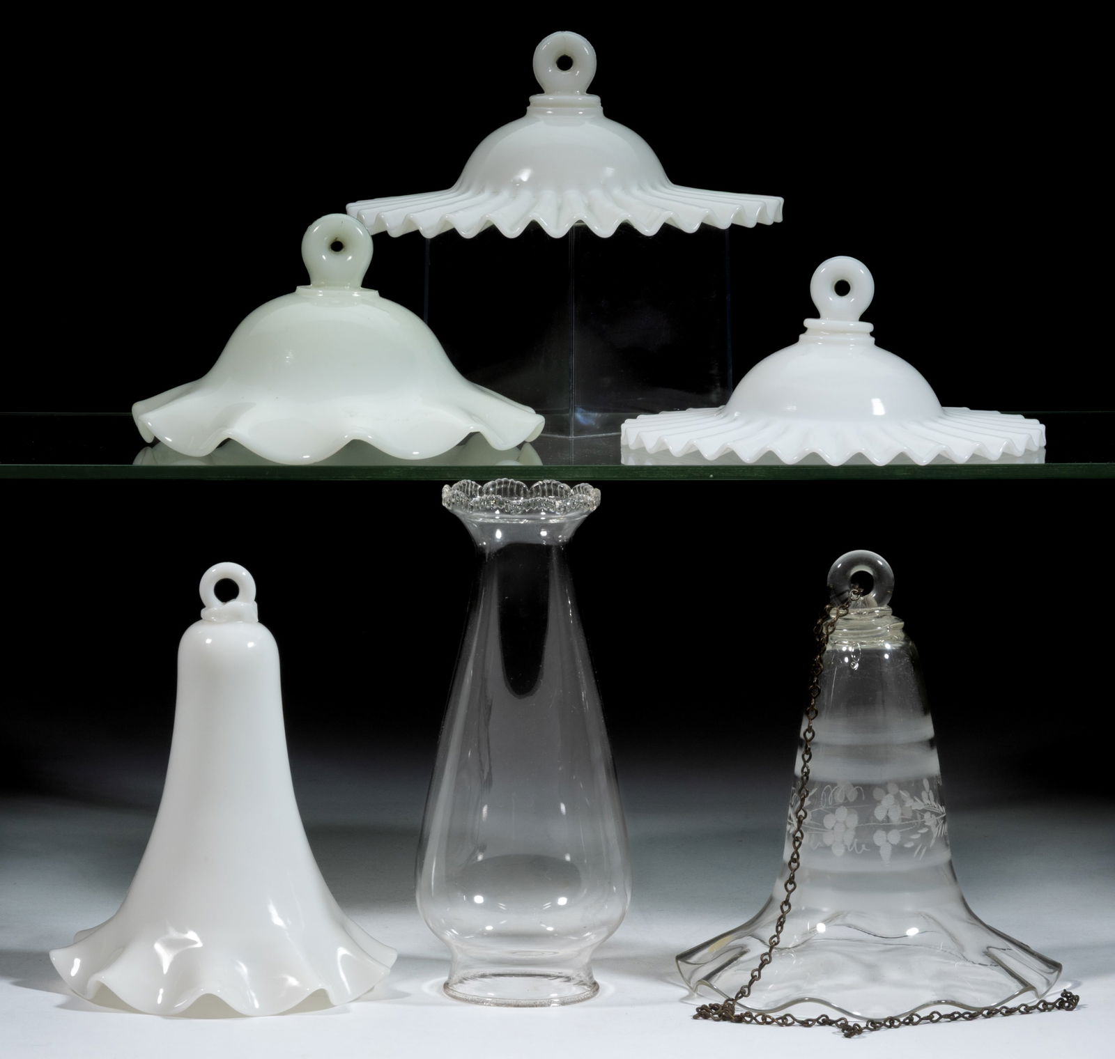 ASSORTED SMOKE BELLS AND CHIMNEY, LOT OF SIX: ASSORTED SMOKE BELLS AND CHIMNEY, LOT OF SIX, comprising a colorless smoke bell with etched vine and berry decoration and hanging chain, four opaque white/milk glass smoke bells, and a No. 2 colorless