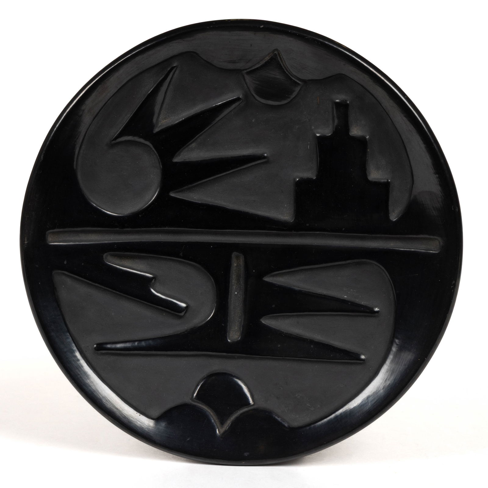 SIGNED ROSE GONZALEZ (1900-1989) NATIVE AMERICAN SAN ILDEFONSO PUEBLO BLACKWARE POTTERY LARGE PLATE: SIGNED ROSE GONZALEZ (1900-1989) NATIVE AMERICAN SAN ILDEFONSO PUEBLO BLACKWARE POTTERY LARGE PLATE, carved decoration featuring stylized avian forms, signed to underside. Mid 20th cent