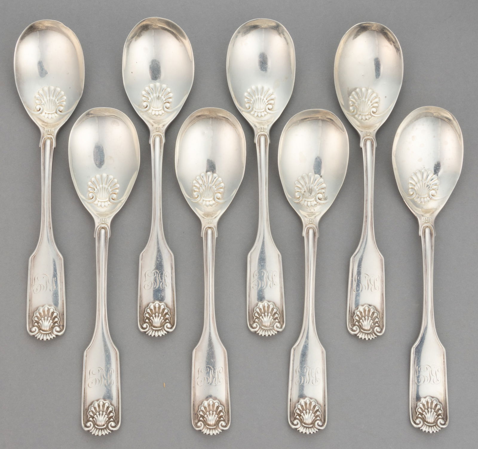FRANK W. SMITH "FIDDLE SHELL / ALDEN" STERLING SILVER ICE CREAM, OR OTHER, SPOONS, SET OF EIGHT: FRANK W. SMITH "FIDDLE SHELL / ALDEN" STERLING SILVER ICE CREAM, OR OTHER, SPOONS, SET OF EIGHT, pattern designed in 1914 by Frank W. Smith, each having an egg-form bowl with embossed shell