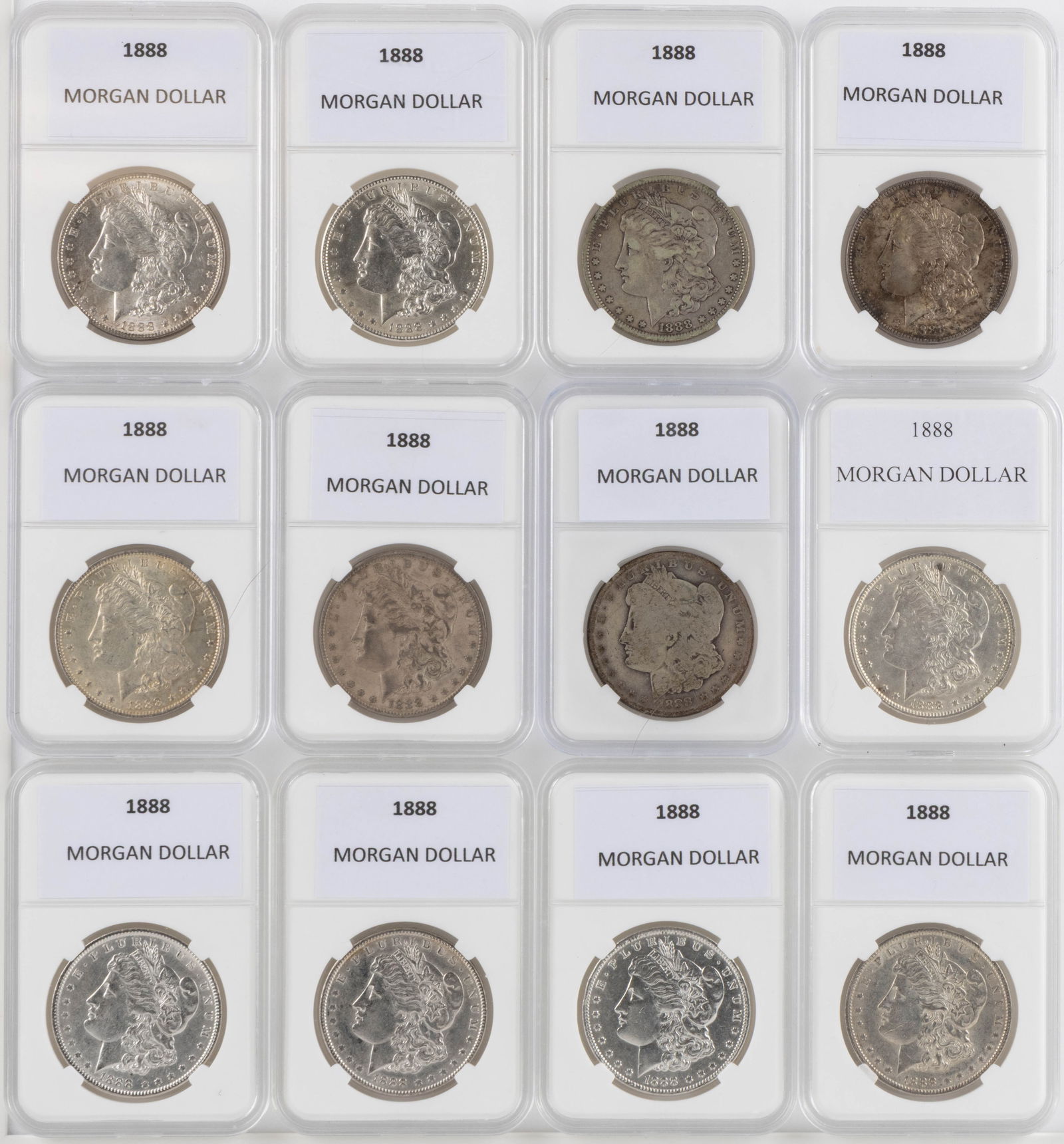 UNITED STATES 1888 MORGAN SILVER DOLLAR COINS, LOT OF 12: UNITED STATES 1888 MORGAN SILVER DOLLAR COINS, LOT OF 12, each housed in a plastic presentation case. Provenance: From the collection of a prominent Northern VA gentleman.