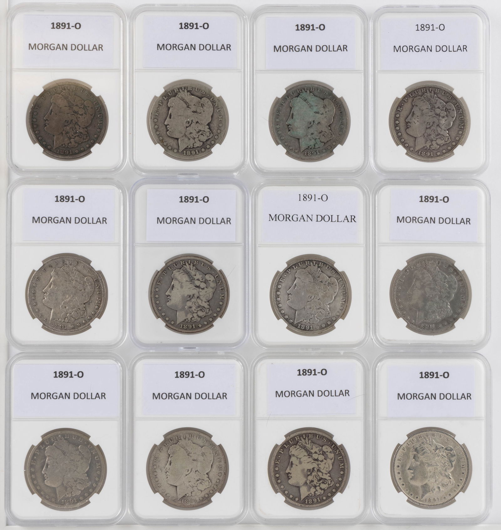 UNITED STATES 1891-O MORGAN SILVER DOLLAR COINS, LOT OF 12: UNITED STATES 1891-O MORGAN SILVER DOLLAR COINS, LOT OF 12, each housed in a plastic presentation case. Provenance: From the collection of a prominent Northern VA gentleman.