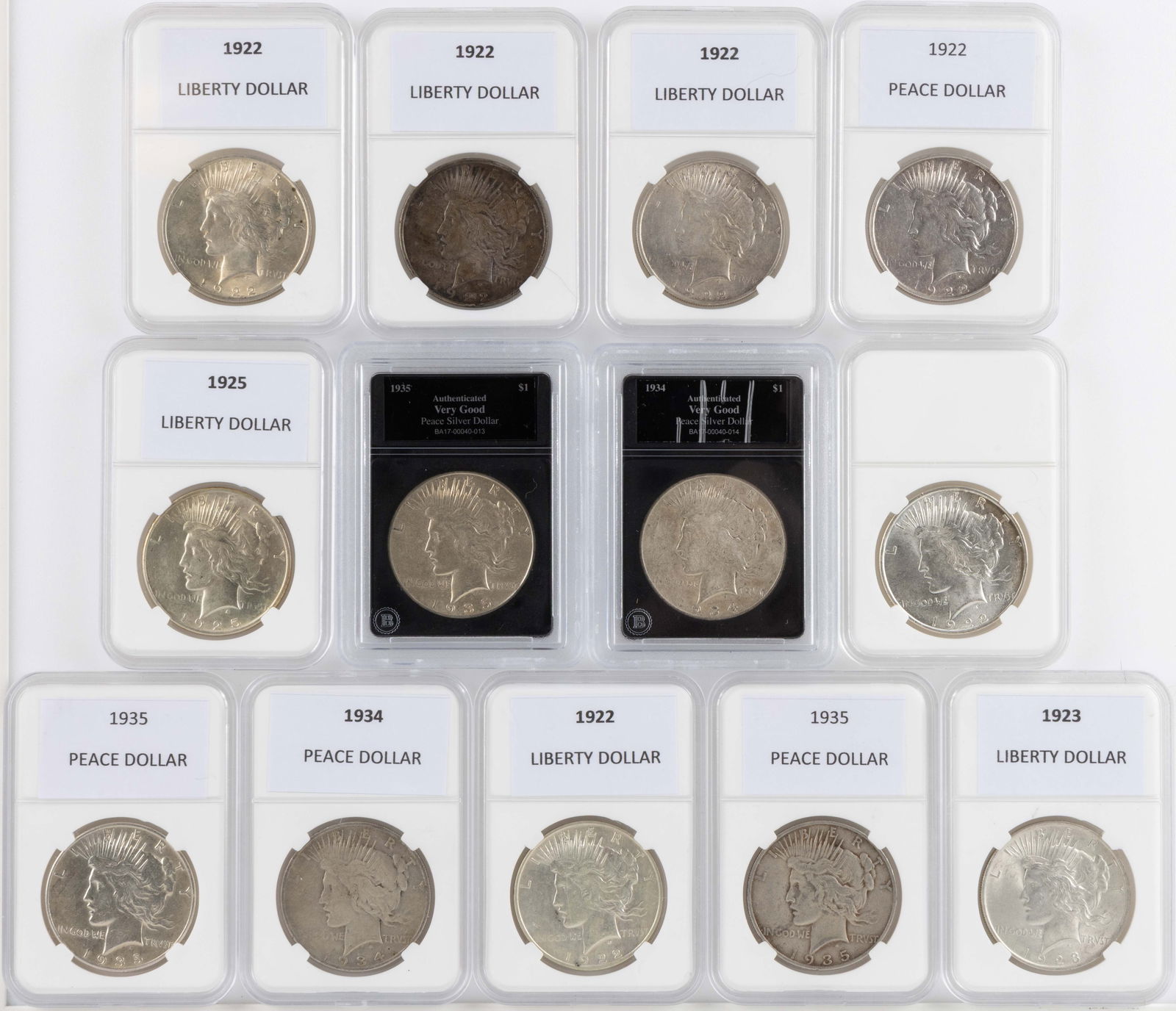 ASSORTED UNITED STATES SILVER PEACE DOLLAR COINS, LOT OF 13: ASSORTED UNITED STATES SILVER PEACE DOLLAR COINS, LOT OF 13, comprising two 1922, four 1922-D, one 1923, one 1925, one 1934-S, one 1934-D, one 1935, and two 1935-S, each housed in a plastic presentati