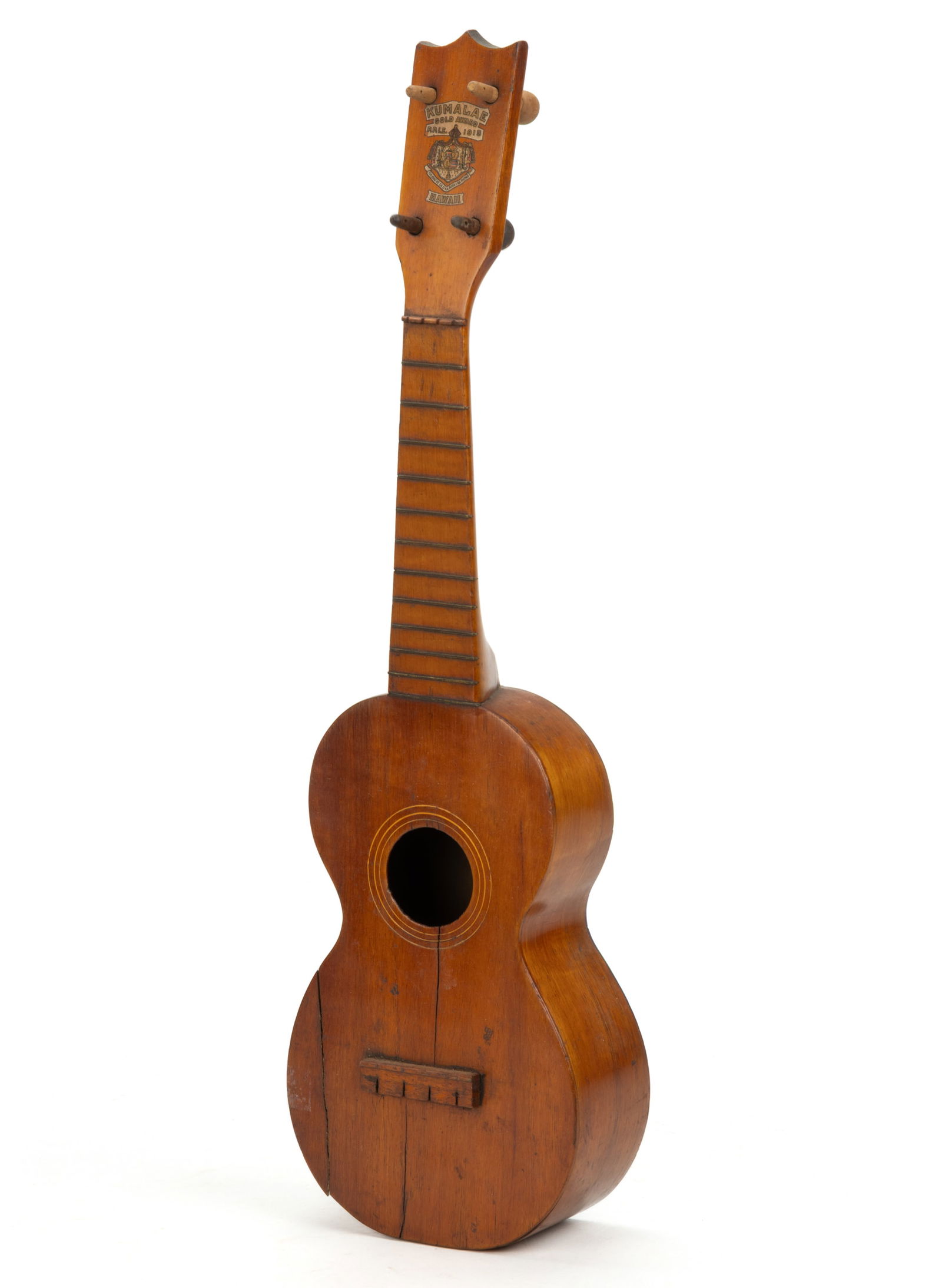 WOODEN JONAH KUMALAE GOLD AWARD 1915 HAWAII UKELELE: WOODEN JONAH KUMALAE GOLD AWARD 1915 HAWAII UKELELE, headstock retains the original labels "KUMALAR / GOLD AWARD / P. P. I. E. 1915 / HAWAII", fitted with four possibly replaced tuner k