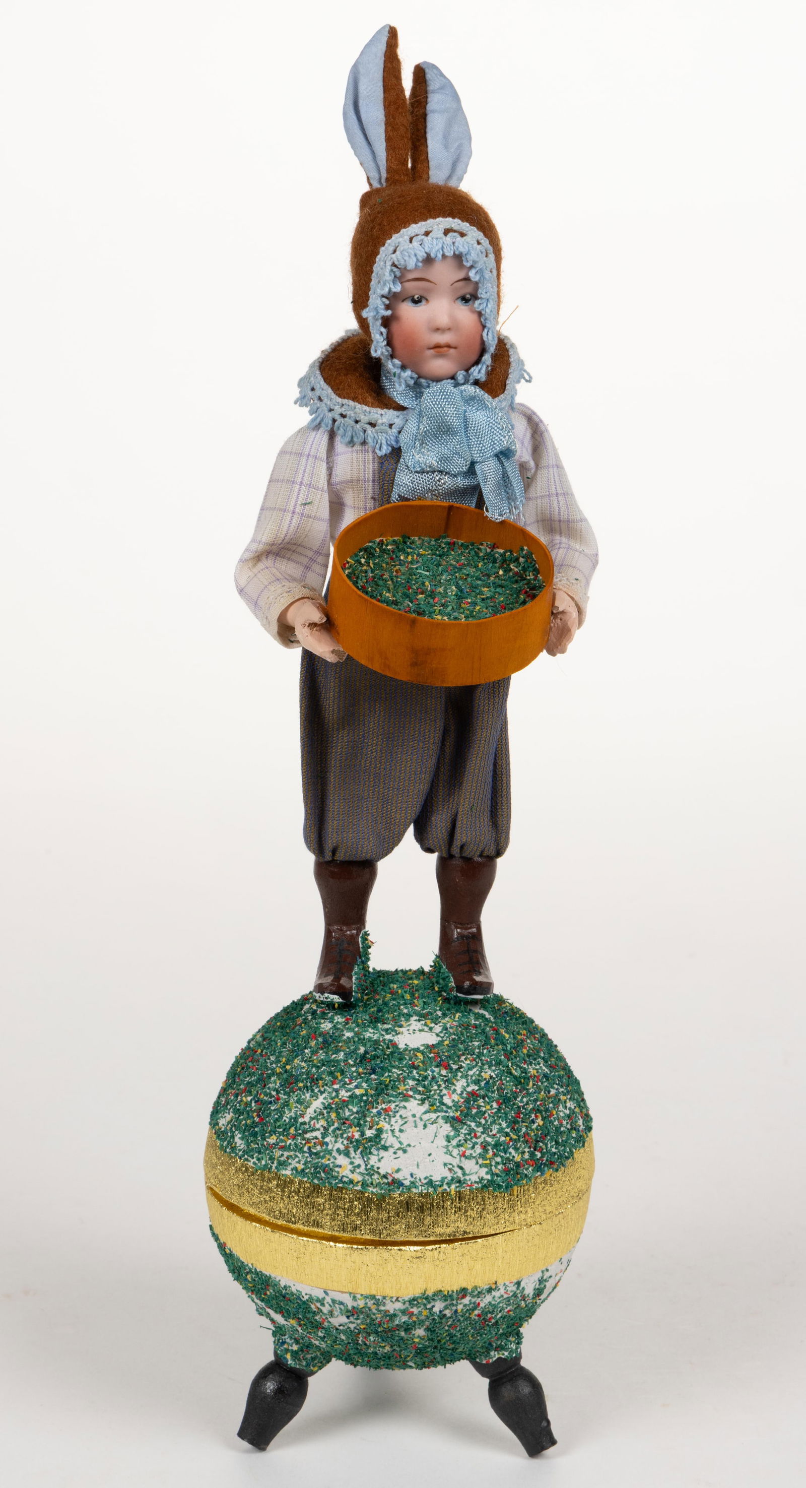 VINTAGE GERMAN GEBRUDER HEUBACH BISQUE-HEAD FIGURAL CHILD CANDY CONTAINER: VINTAGE GERMAN GEBRUDER HEUBACH BISQUE-HEAD FIGURAL CHILD CANDY CONTAINER, depicting a young child with painted facial features, fixed head with shoulder incised "HEUB/ACH", standing and hol