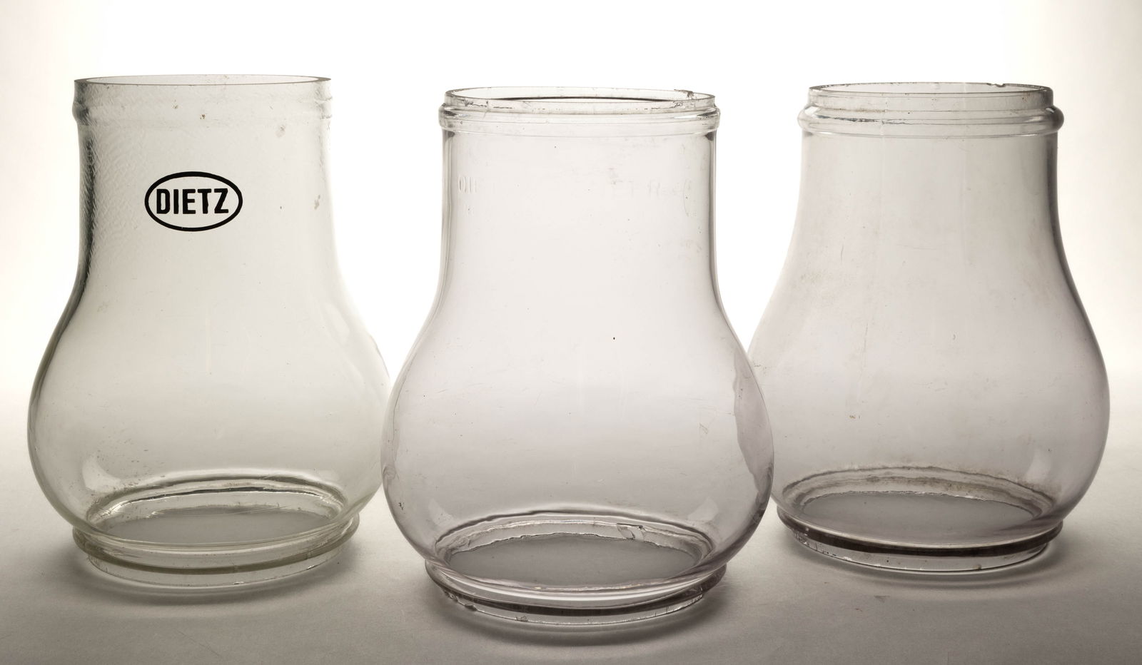 ASSORTED DIETZ AND OTHER STREET / RAILROAD TUBULAR LANTERN GLOBES, LOT OF THREE (1 of 1)