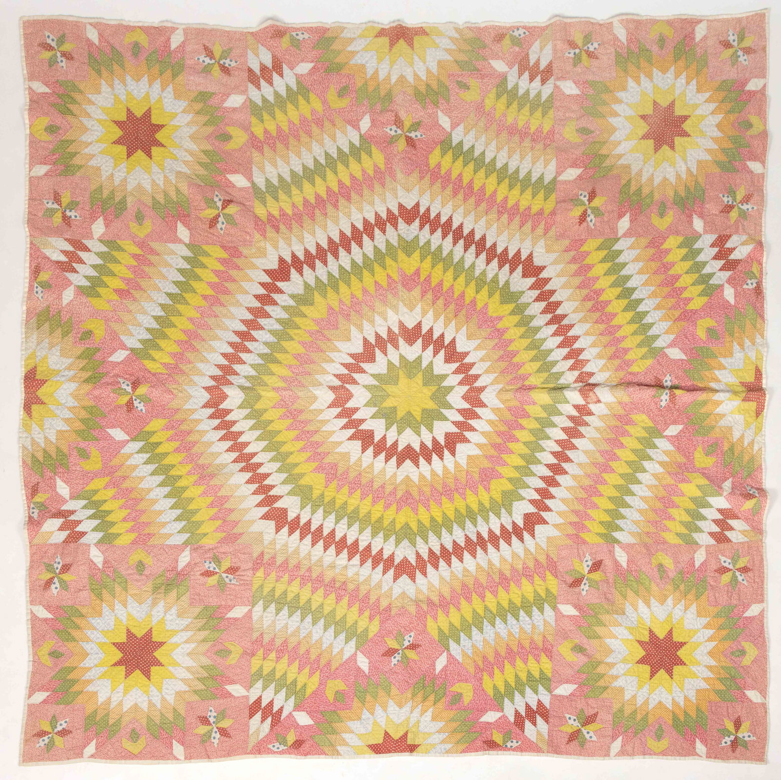 MID-ATLANTIC "LONE STAR / STAR OF BETHLEHEM" APPLIQUE AND PIECED QUILT: MID-ATLANTIC "LONE STAR / STAR OF BETHLEHEM" APPLIQUE AND PIECED QUILT, hand-stitched, completed in polychrome print fabrics including double-pink, red, green, and yellow colors, large centr