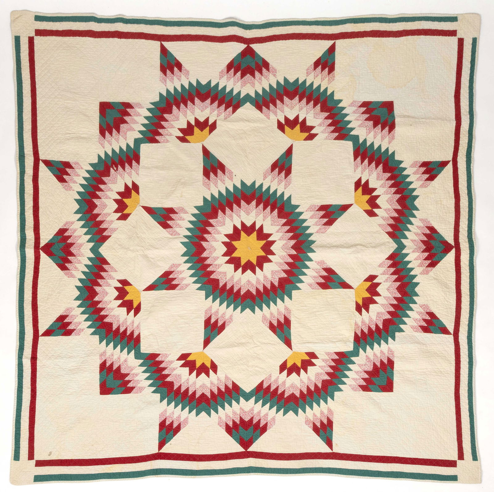AMERICAN "BROKEN STAR / STAR OF BETHLEHEM" PIECED QUILT: AMERICAN "BROKEN STAR / STAR OF BETHLEHEM" PIECED QUILT, hand-stitched, completed in pink print and yellow, green, red, and white solid fabrics, featuring a central large eight-pointed star