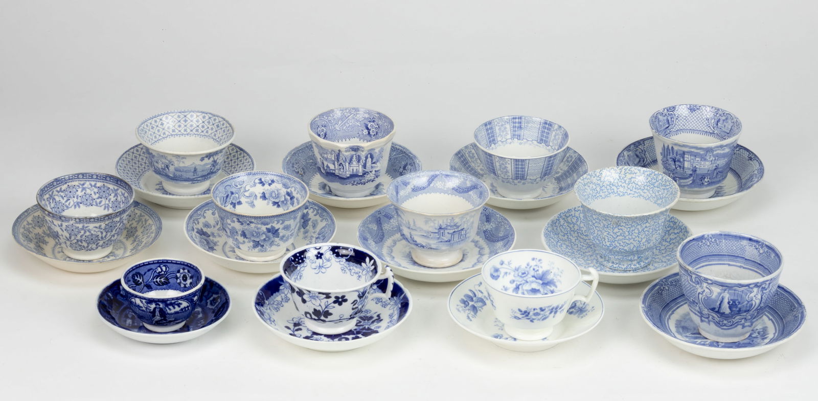 STAFFORDSHIRE BLUE TRANSFER-PRINTED CERAMIC CUP AND SAUCER SETS, LOT OF 12 (1 of 1)