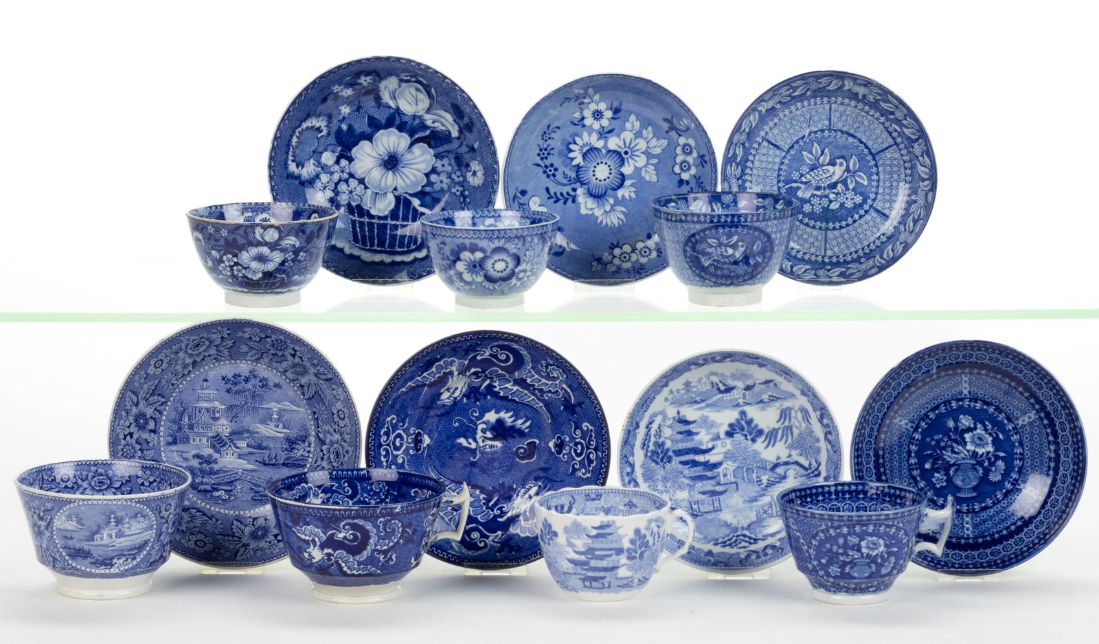 STAFFORDSHIRE BLUE TRANSFER-PRINTED CERAMIC CUP AND SAUCER SETS, LOT OF SEVEN (1 of 1)