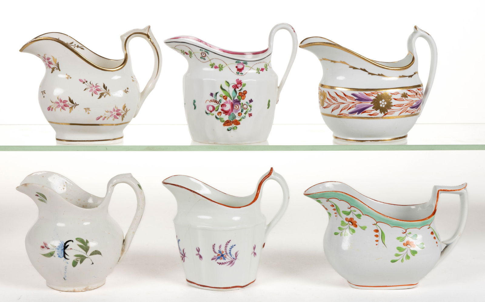 ENGLISH HAND-PAINTED CERAMIC FLORAL MOTIF CREAMERS, LOT OF SIX (1 of 2)