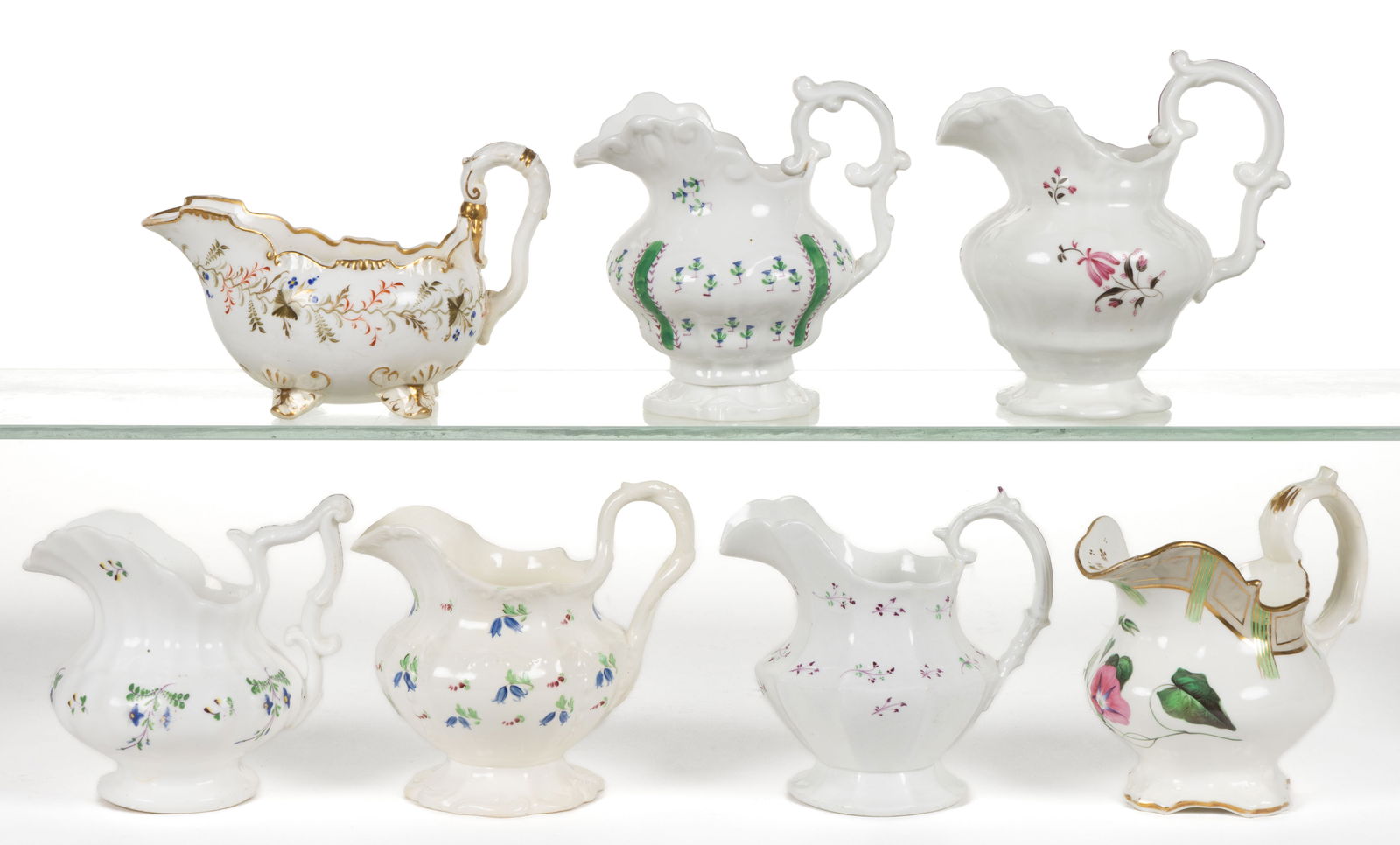 ENGLISH HAND-PAINTED PORCELAIN FLORAL MOTIF CREAMERS, LOT OF SEVEN (1 of 1)