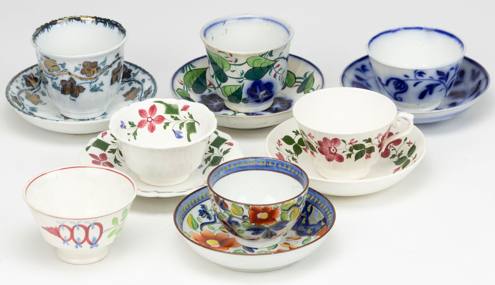 ENGLISH GAUDY DUTCH AND OTHER SIMILAR CERAMIC FLORAL MOTIF CUP AND SAUCER SETS, LOT OF SIX (1 of 1)