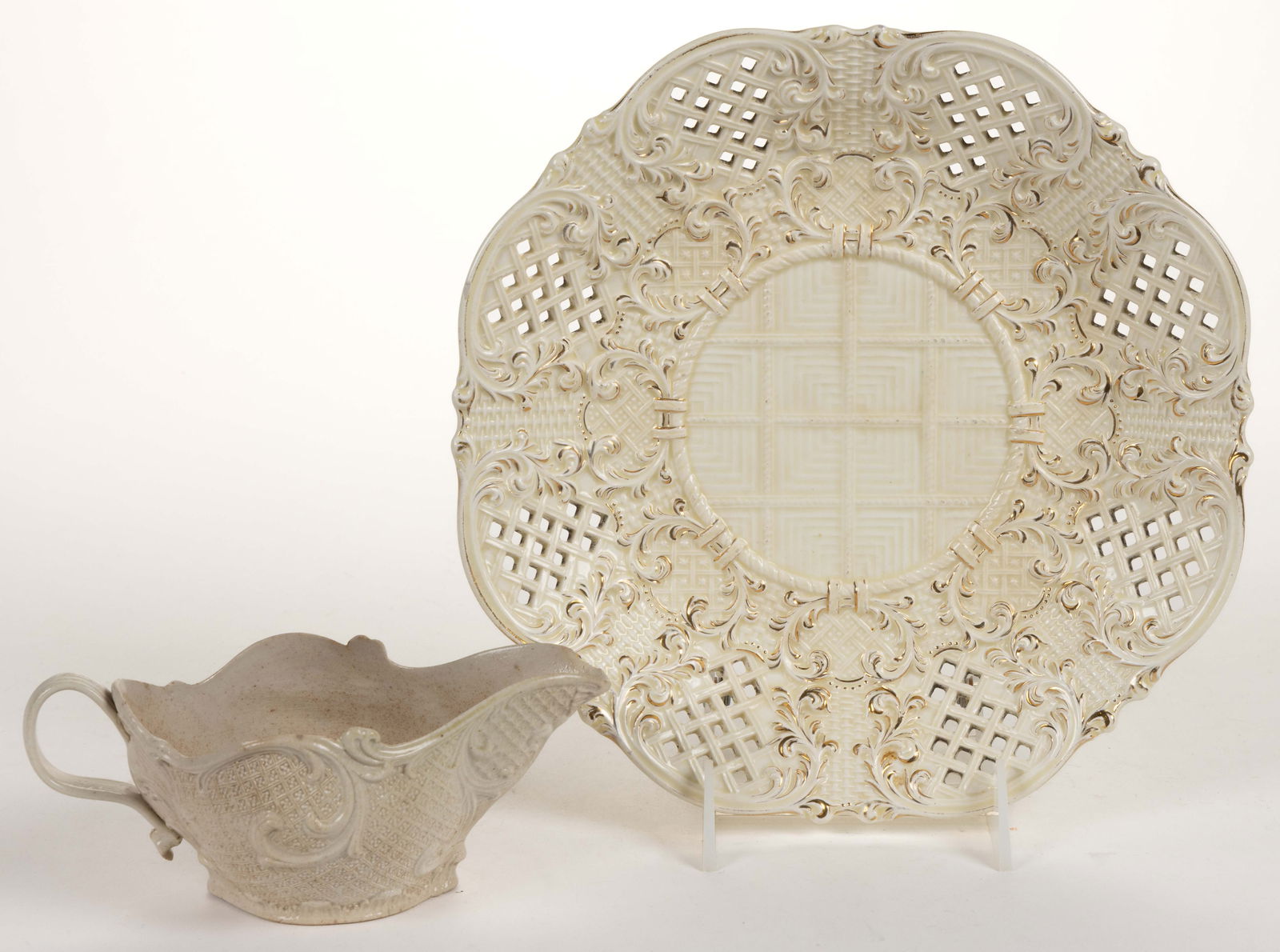 ENGLISH WHITE SALT-GLAZED STONEWARE SAUCE BOAT: ENGLISH WHITE SALT-GLAZED STONEWARE SAUCE BOAT, featuring press-molded dot, diaper, star, and scroll decorations. Unmarked. Probably Yorkshire or Staffordshire. Together with a German W