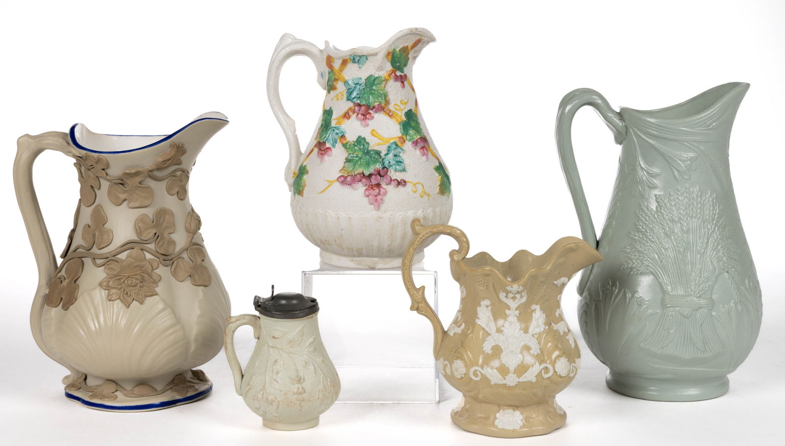 ENGLISH AND GERMAN RELIEF-MOLDED STONEWARE JUGS / PITCHERS, LOT OF FIVE (1 of 2)