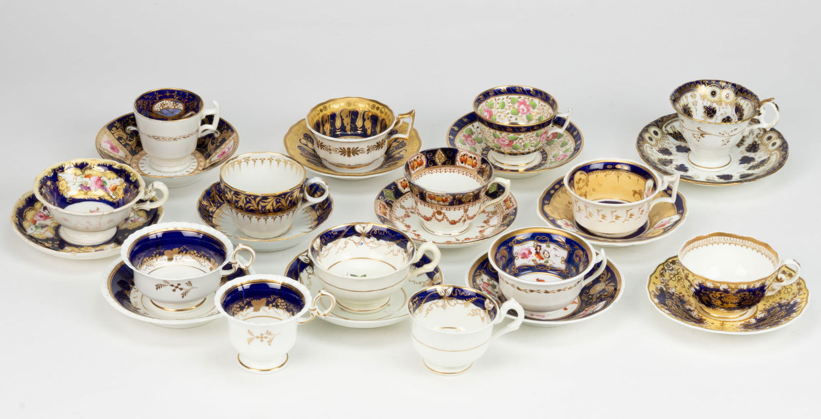 ENGLISH PORCELAIN COBALT-DECORATED CUP AND SAUCER SETS, LOT OF 12 (1 of 1)