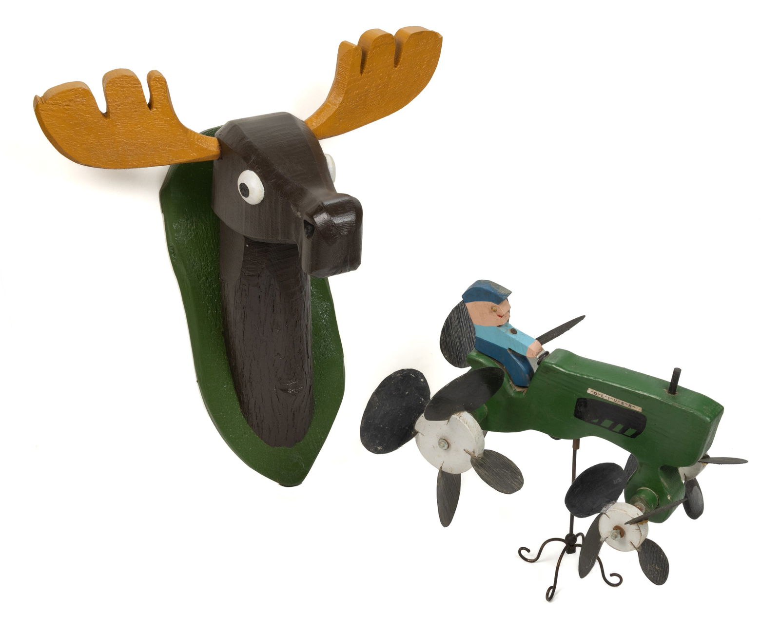AMERICAN FOLK ART CARVED AND PAINTED WHIRLIGIG AND SCULPTURE: AMERICAN FOLK ART CARVED AND PAINTED WHIRLIGIG AND SCULPTURE, each of carved and painted wood, comprising a tractor whirligig with plastic fins on each of the wheels and a name of "OLIVER" o