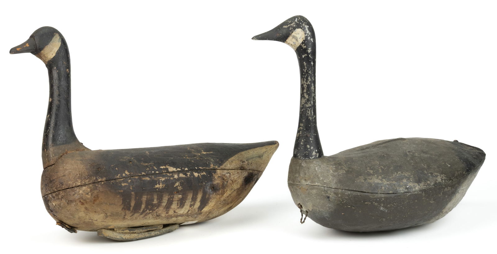 AMERICAN FOLK ART PAINTED CANADA GOOSE DECOYS, LOT OF TWO: AMERICAN FOLK ART PAINTED CANADA GOOSE DECOYS, LOT OF TWO, comprising a wooden solid-body form and a cast metal example, each retaining possibly original painted surface. First hal